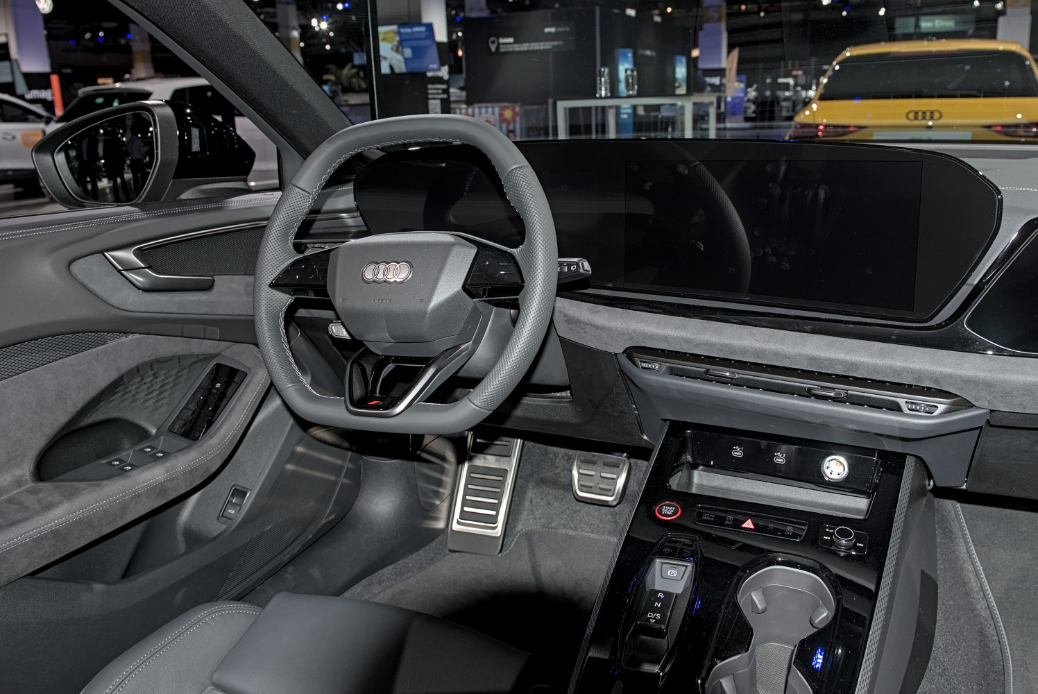 Digital dashboard and modern steering wheel in car interior