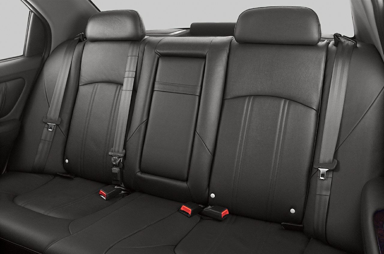 Black leather rear seat with seatbelts and headrests