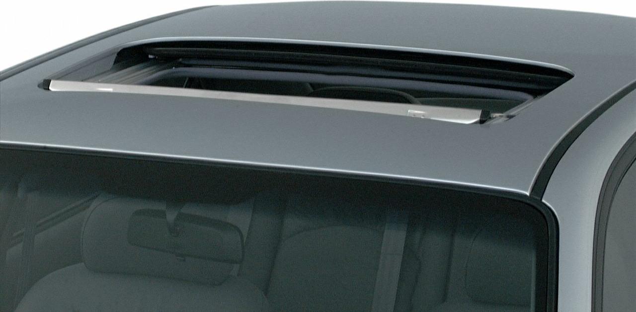 Open sunroof on car roof with partial vehicle interior visible