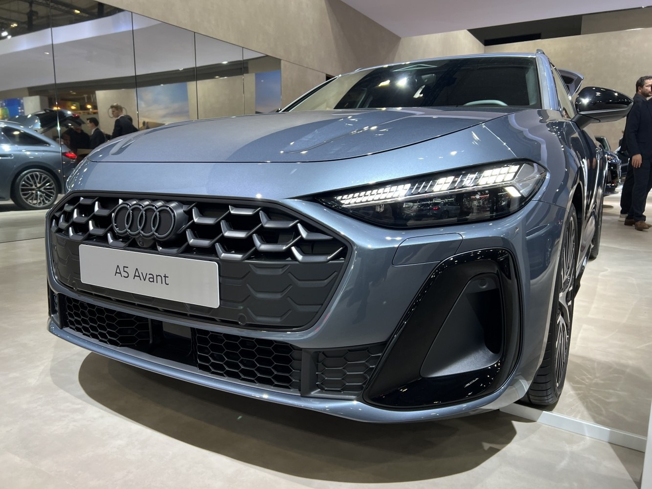 Close-up of hexagonal front grille and LED headlights