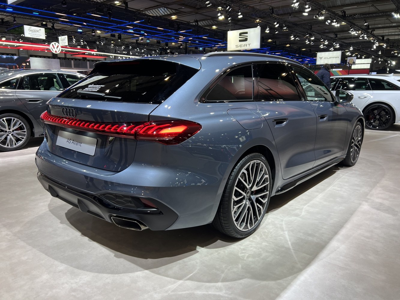 Rear side view of sleek station wagon with distinctive LED tail light strip