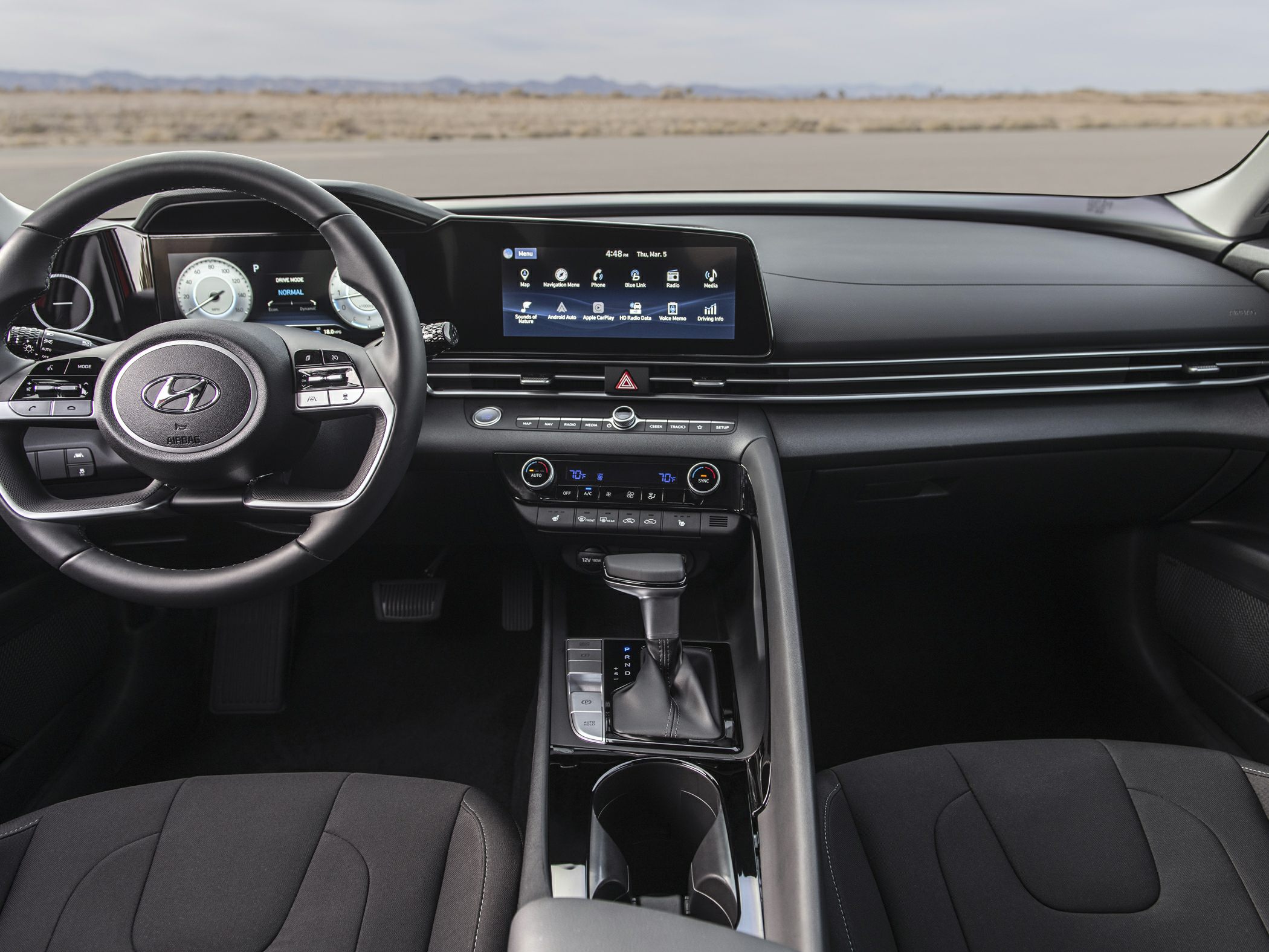 Digital instrument cluster and touchscreen infotainment system in modern black interior