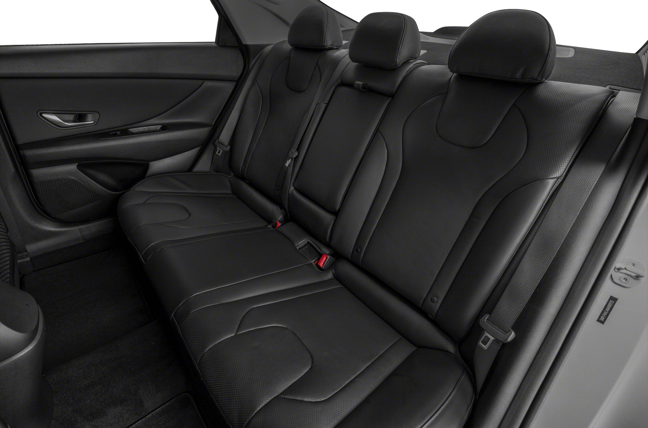 Black leather rear seats with headrests and seat belts.
