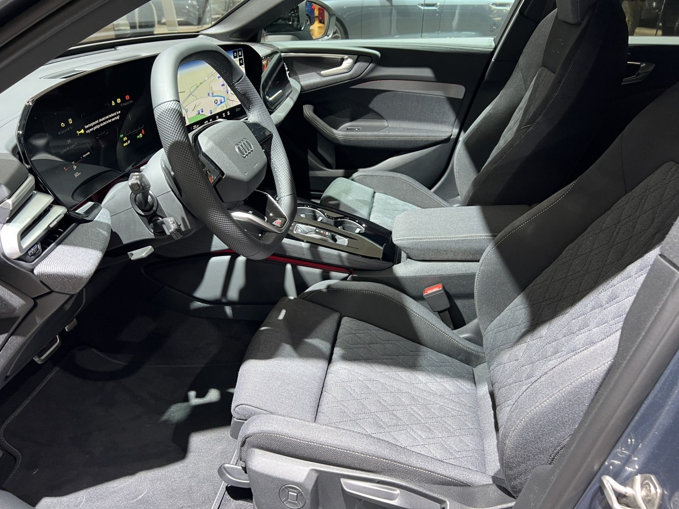 Modern digital cockpit and sport seats in car interior