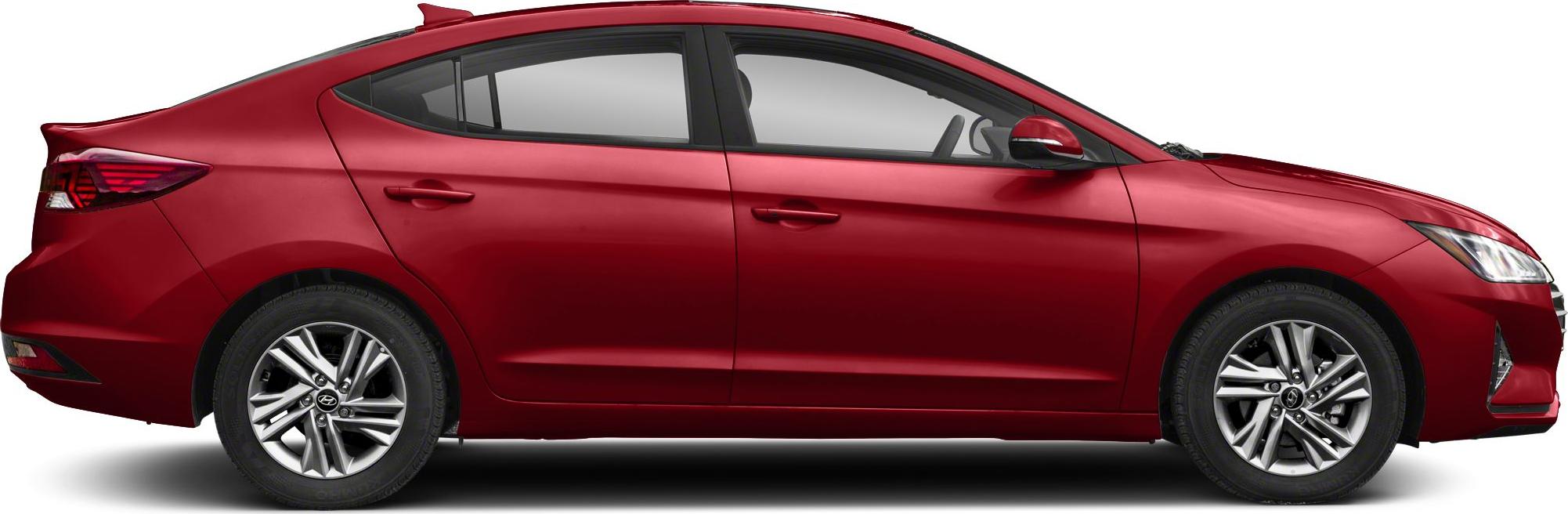 Red sedan side profile with alloy wheels