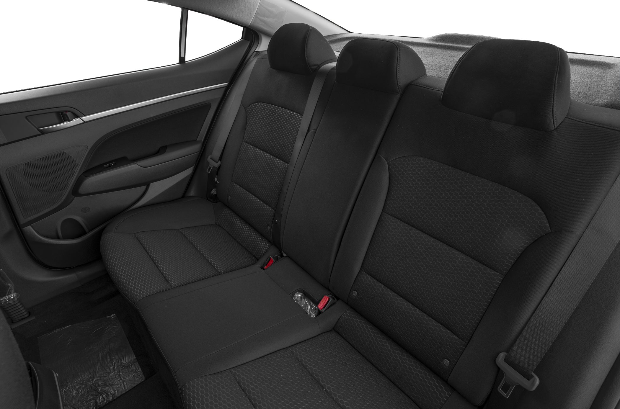Rear seating with black upholstery and three headrests