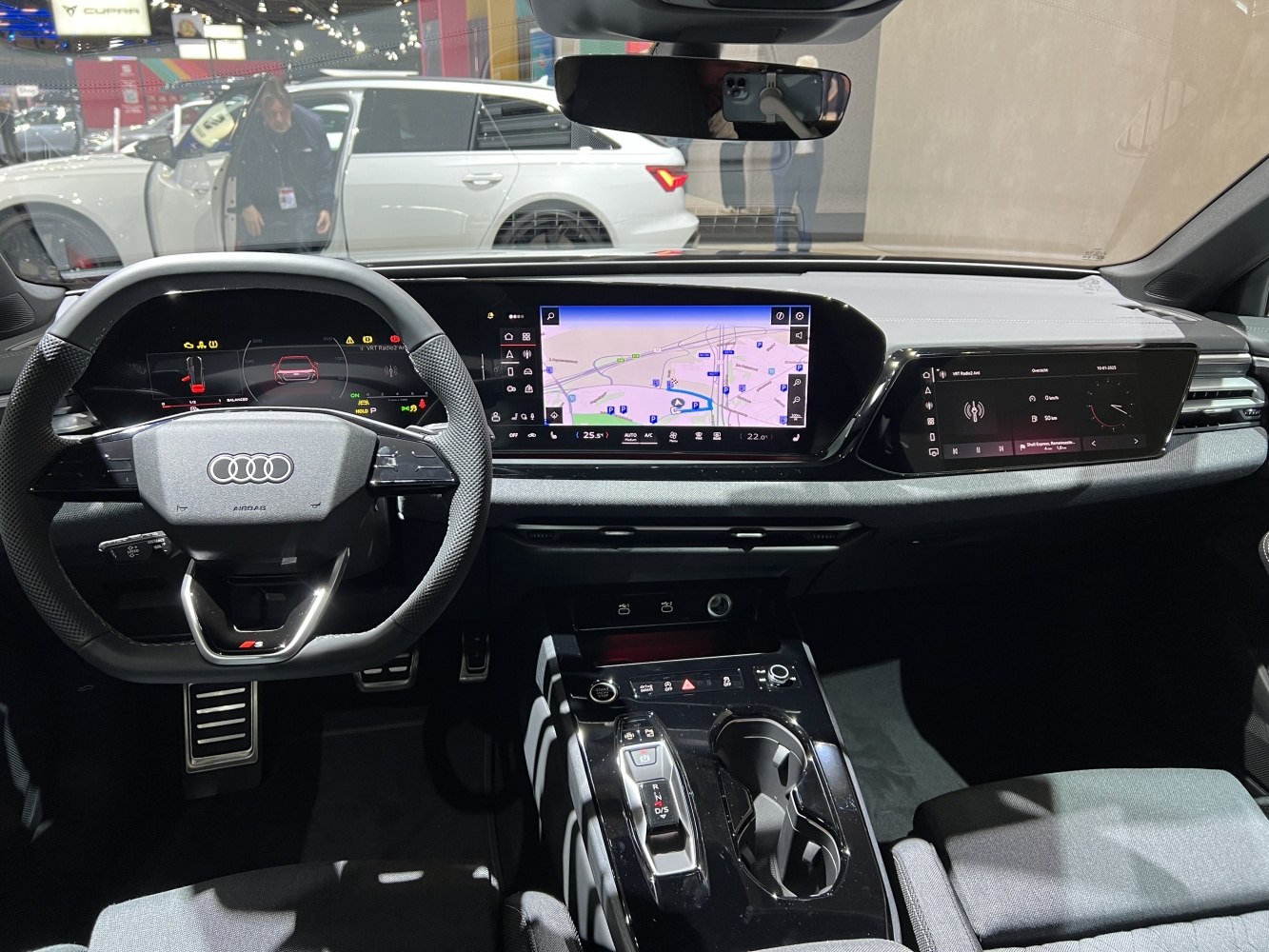 Digital dashboard and dual touchscreen infotainment in luxury car interior