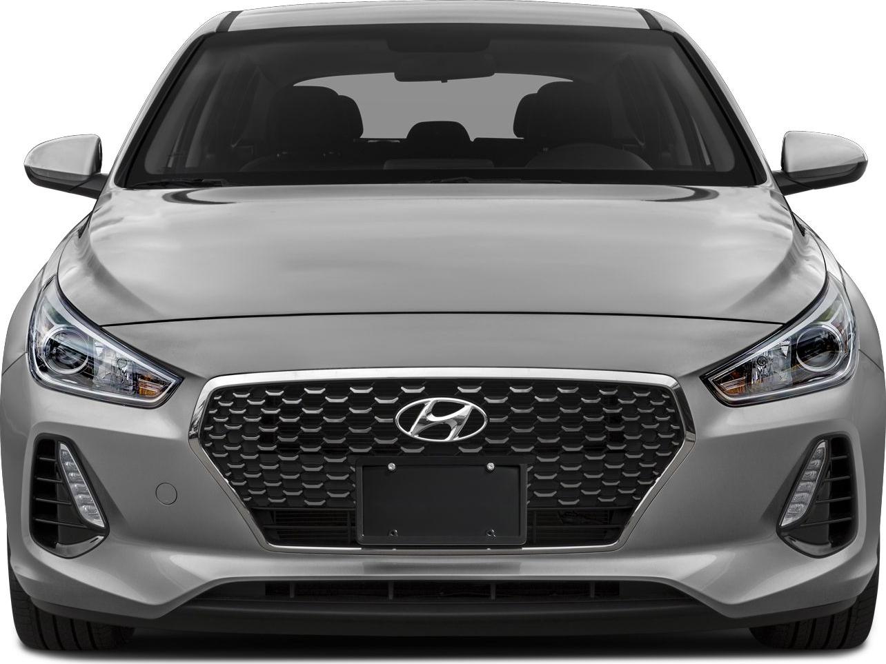 Front view showing hexagonal grille and sleek headlights.