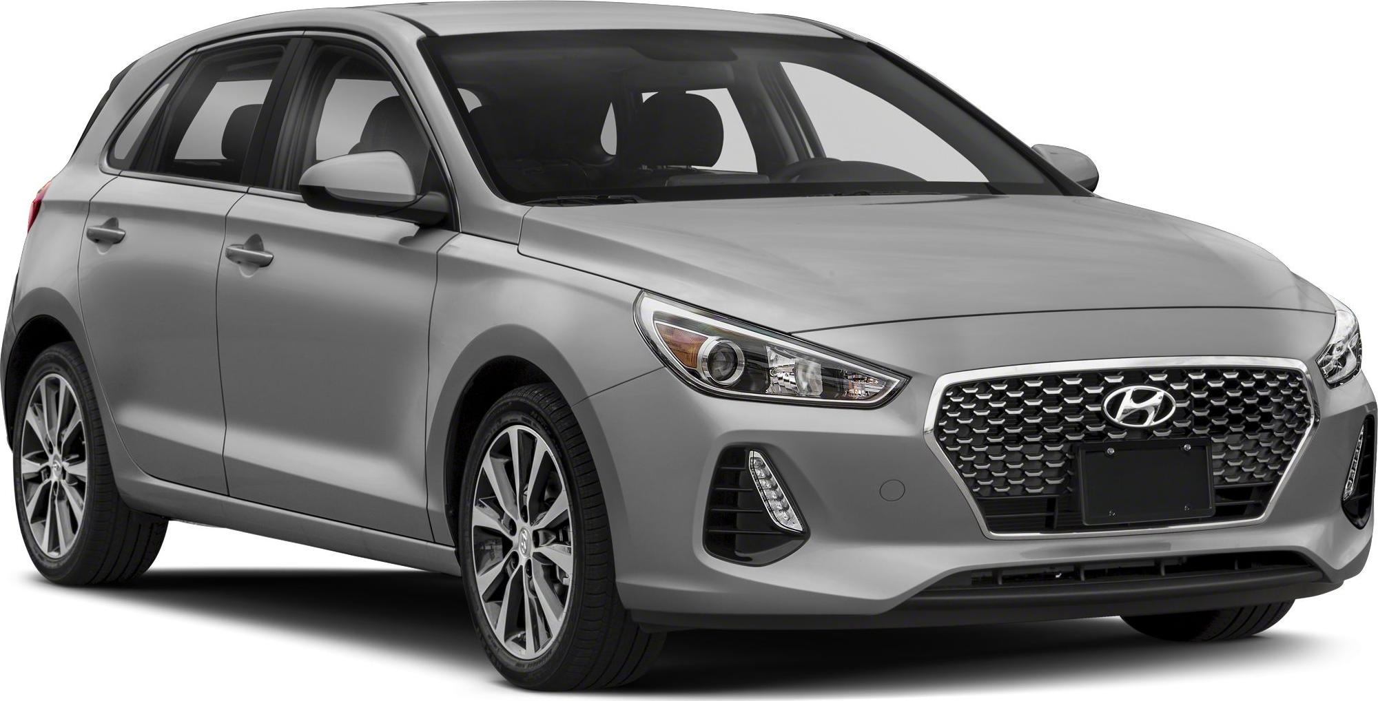 Front side view of hatchback with hexagonal grille and modern headlights