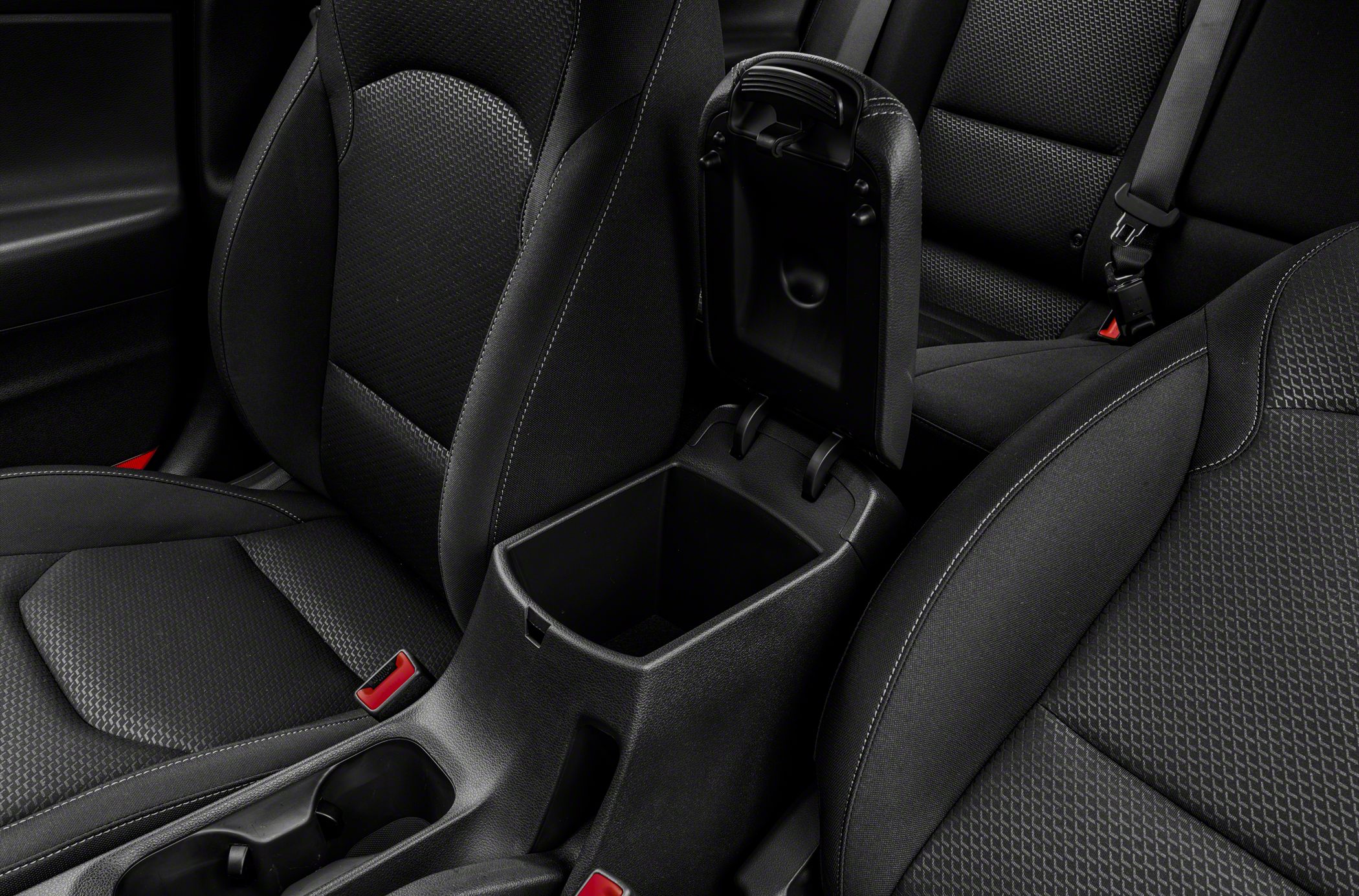 Interior center console storage with black upholstery and seating