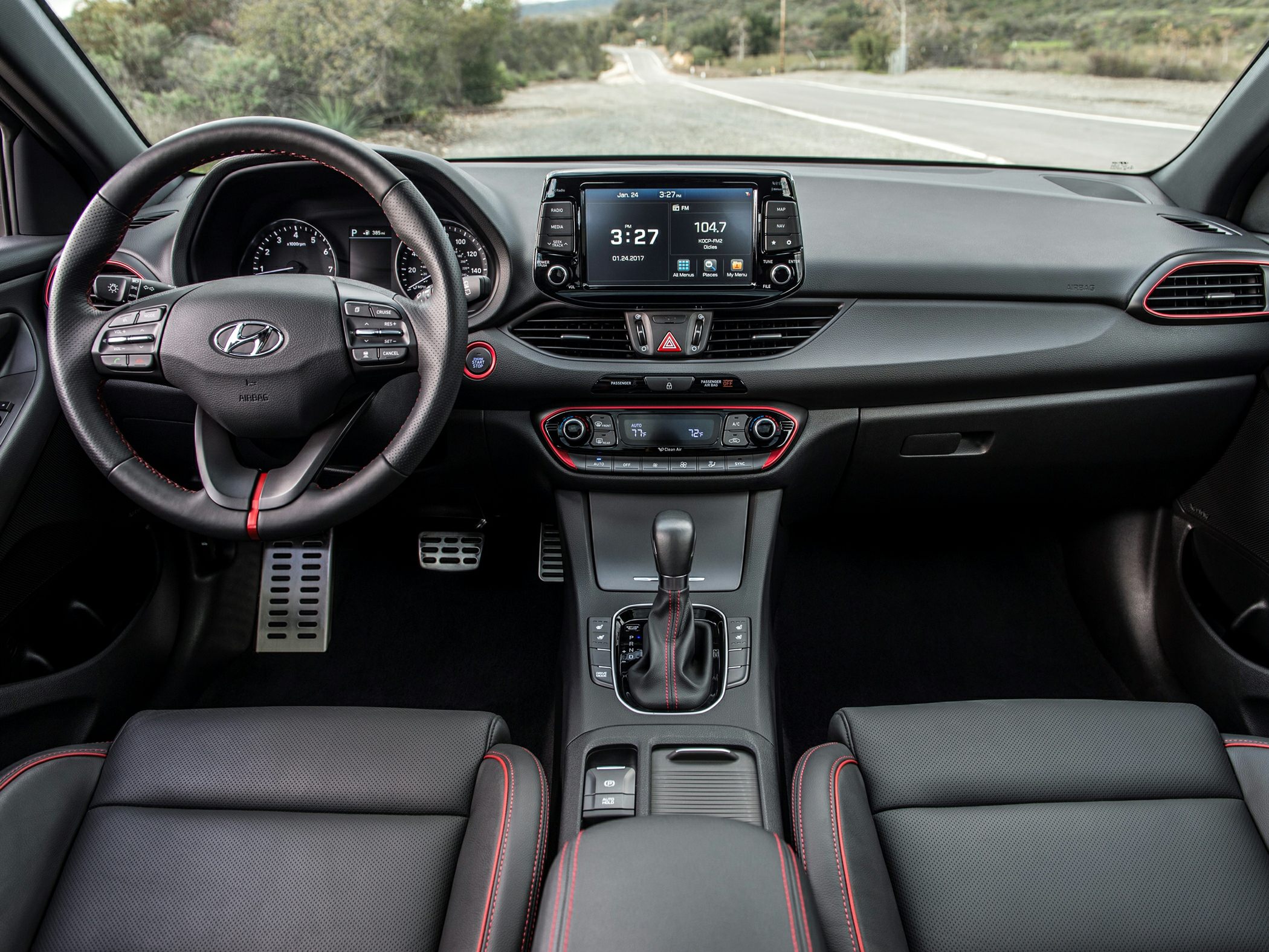 Dashboard, steering wheel with control buttons, central infotainment screen