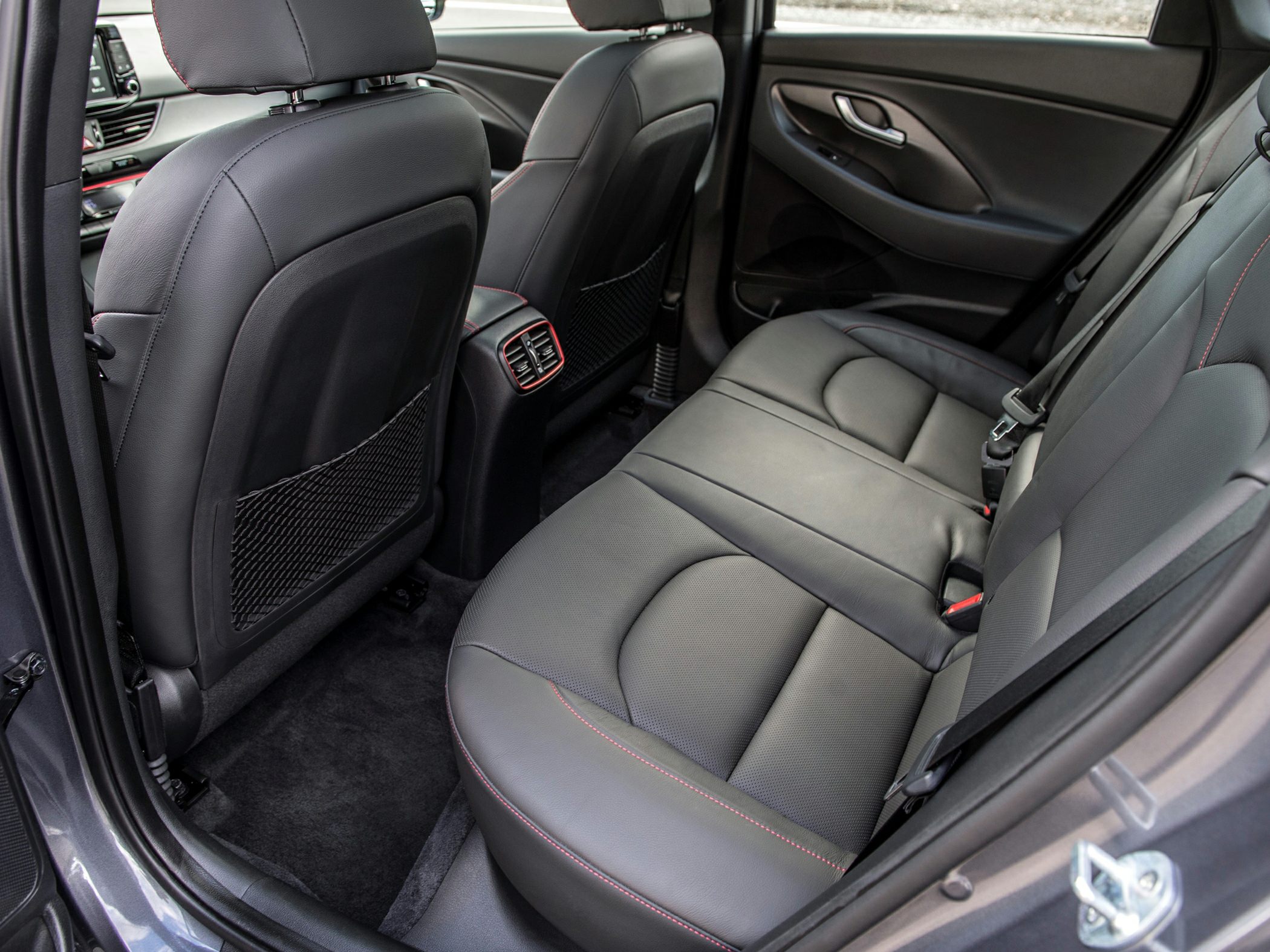 Rear interior with leather seats and spacious legroom