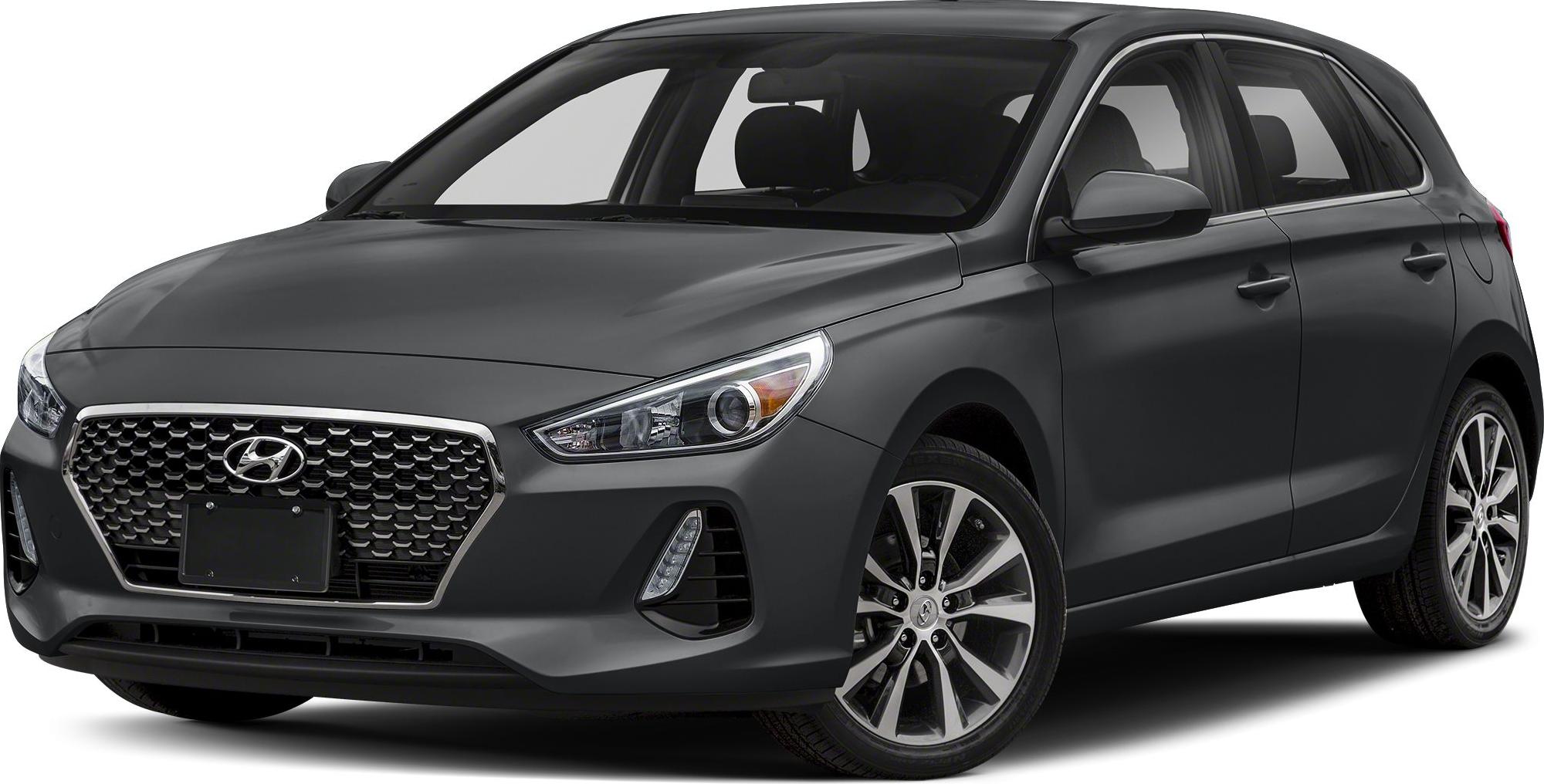 Front-side view with hexagonal grille, headlights, and alloy wheels