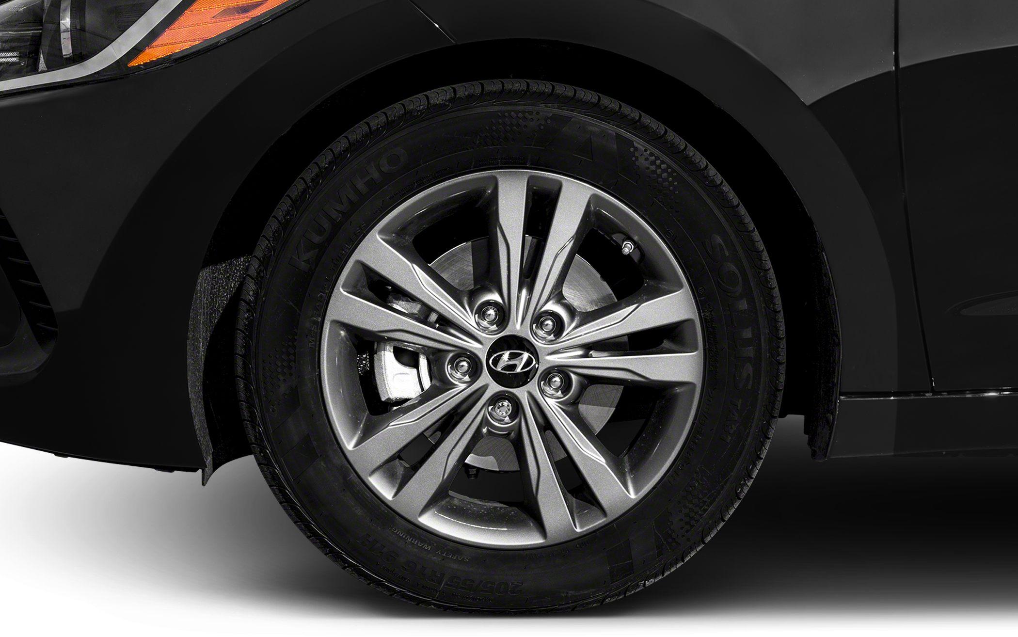 Close-up of alloy wheel and tire with detailed rim and tire tread