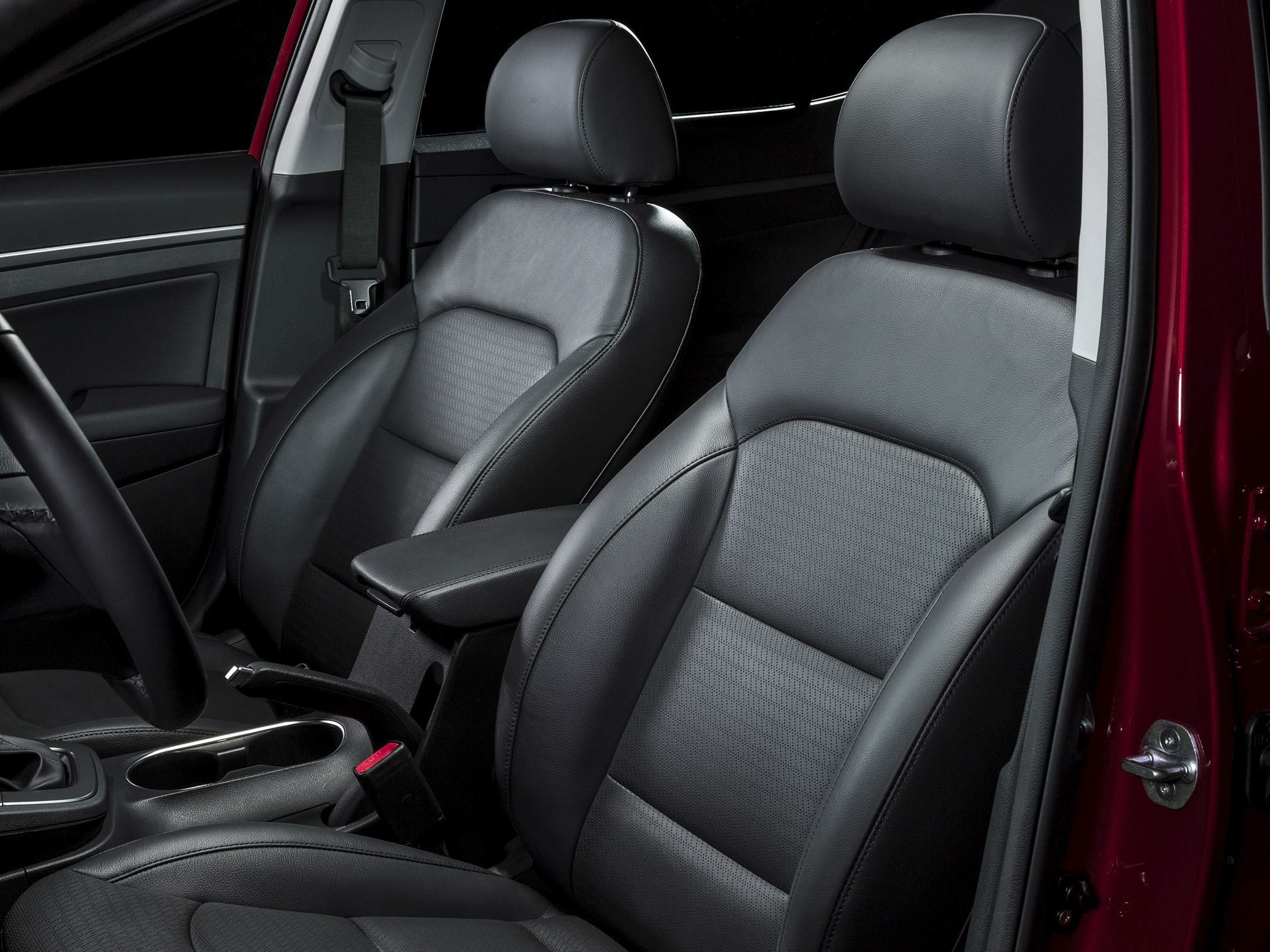 Black leather front seats with headrests and center armrest