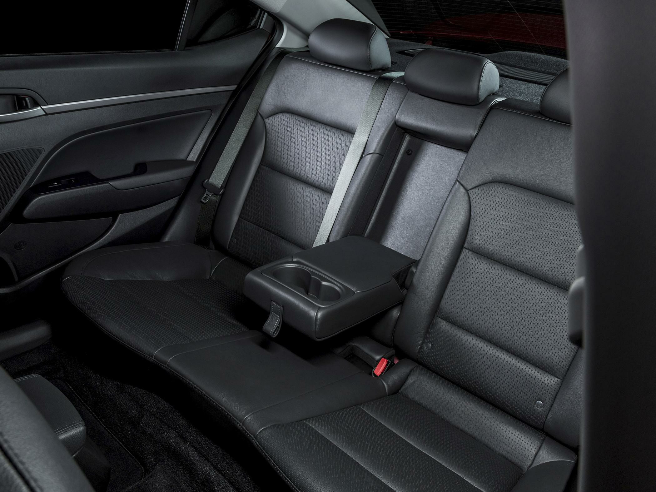 Rear leather seats with foldable armrest and cup holders