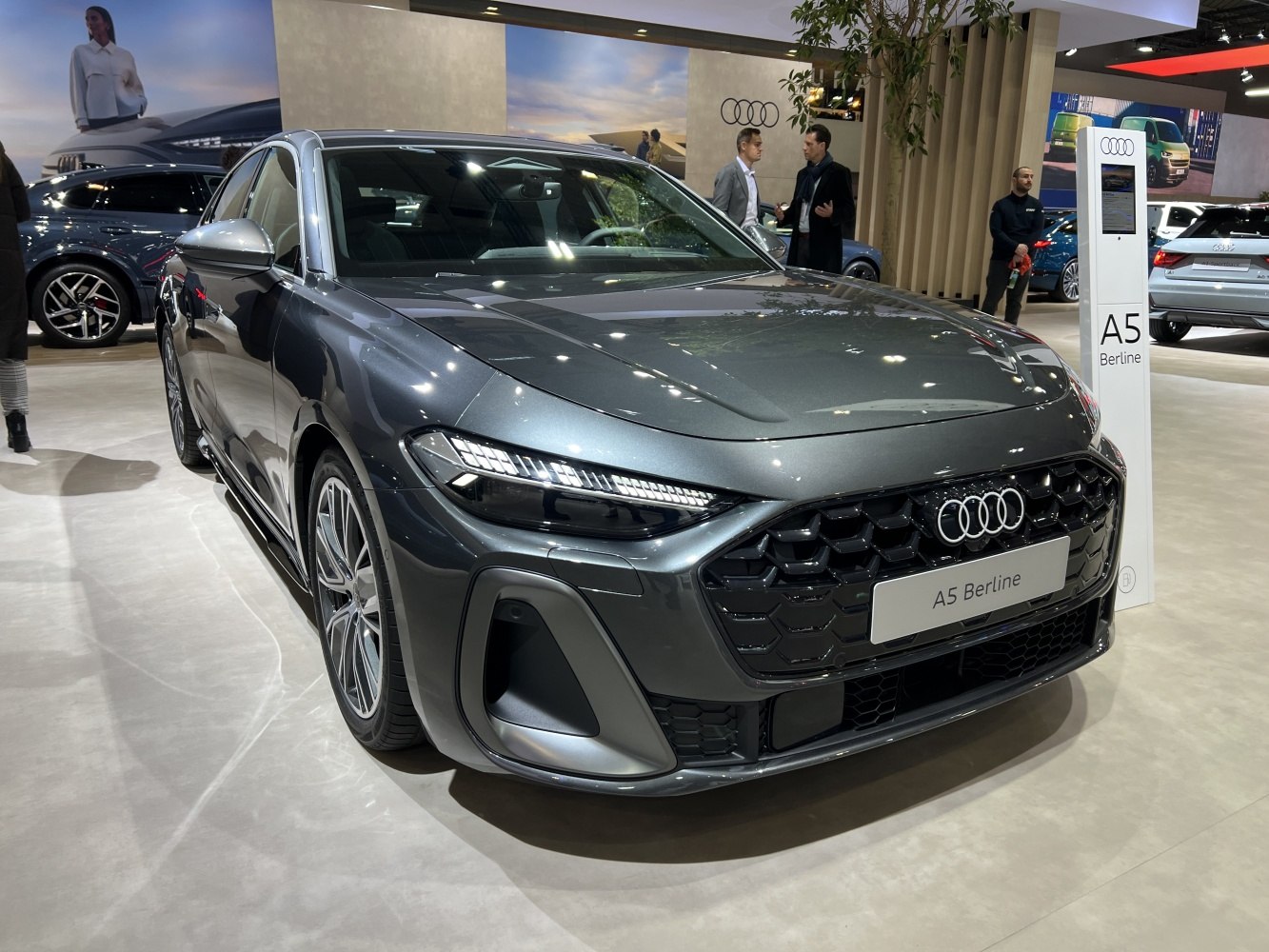 Sleek front grille with sharp LED headlights on modern sedan