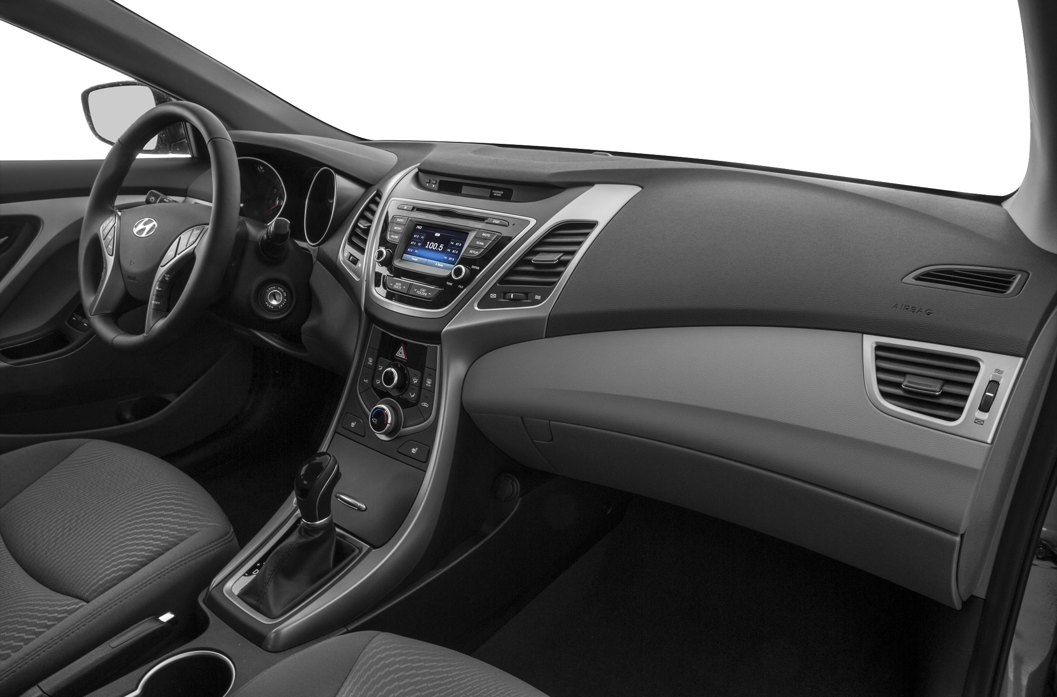 Dashboard, steering wheel, and center console with gear shift