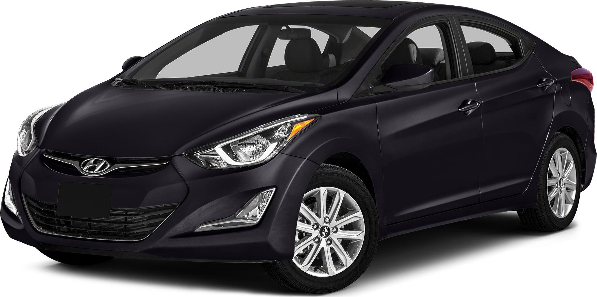 Front side view of compact sedan with sleek headlights and alloy wheels