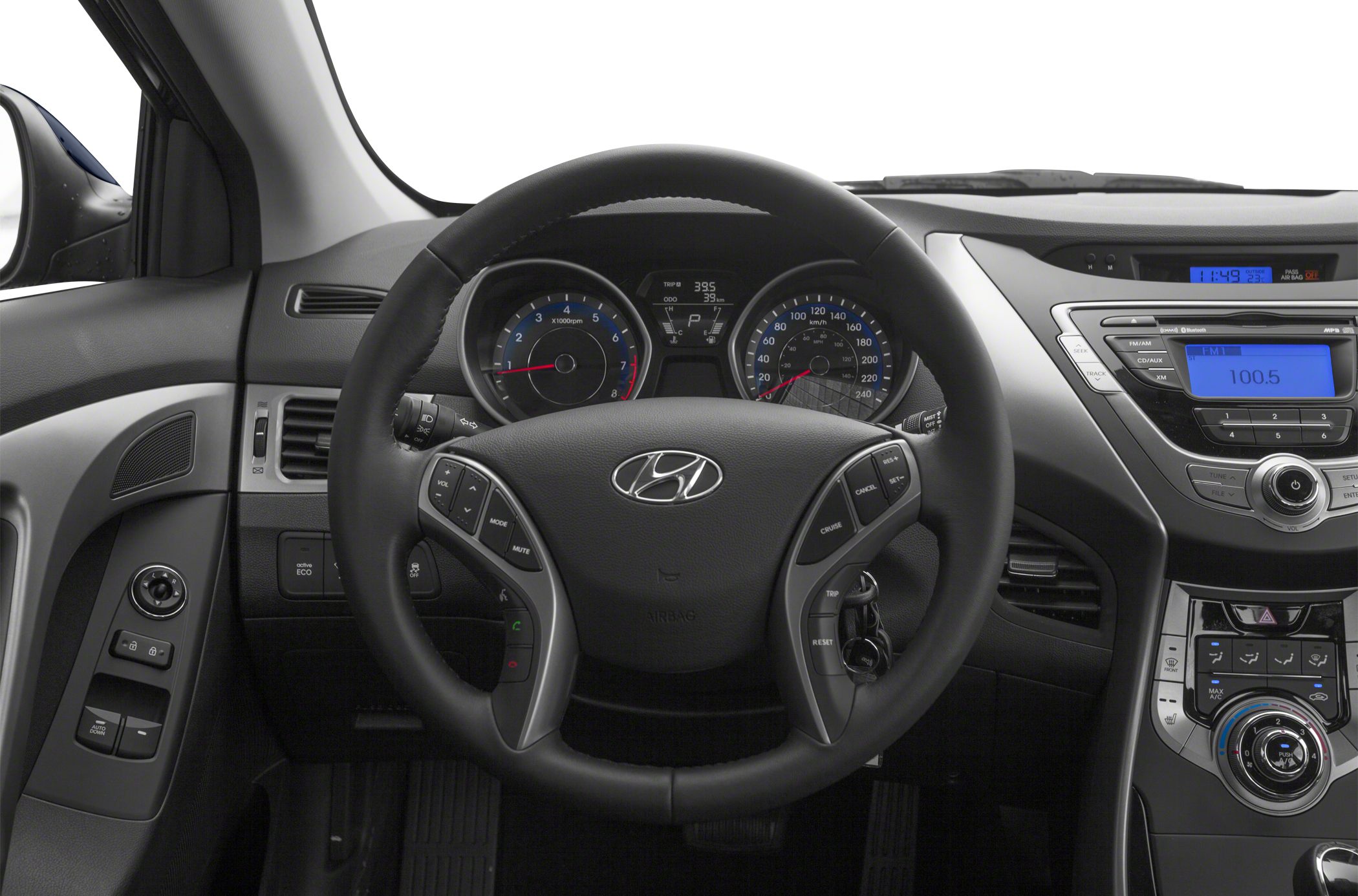 Steering wheel with controls and instrument cluster, dashboard center console with radio and climate controls
