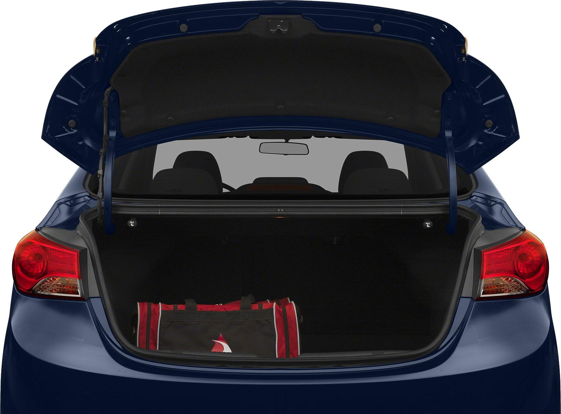 Open trunk of a sedan with a gear bag inside