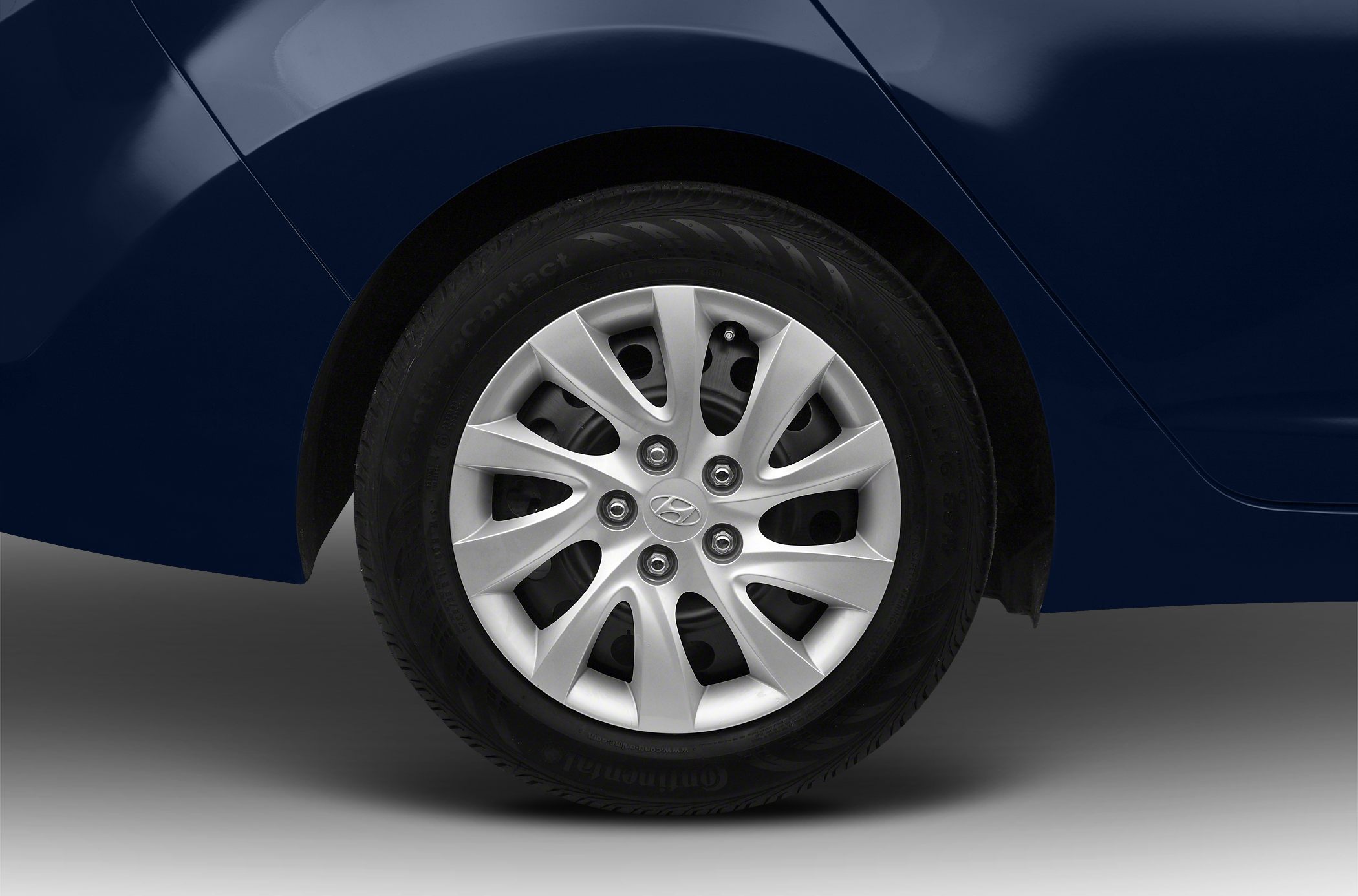 Silver ten-spoke alloy wheel with visible tire tread