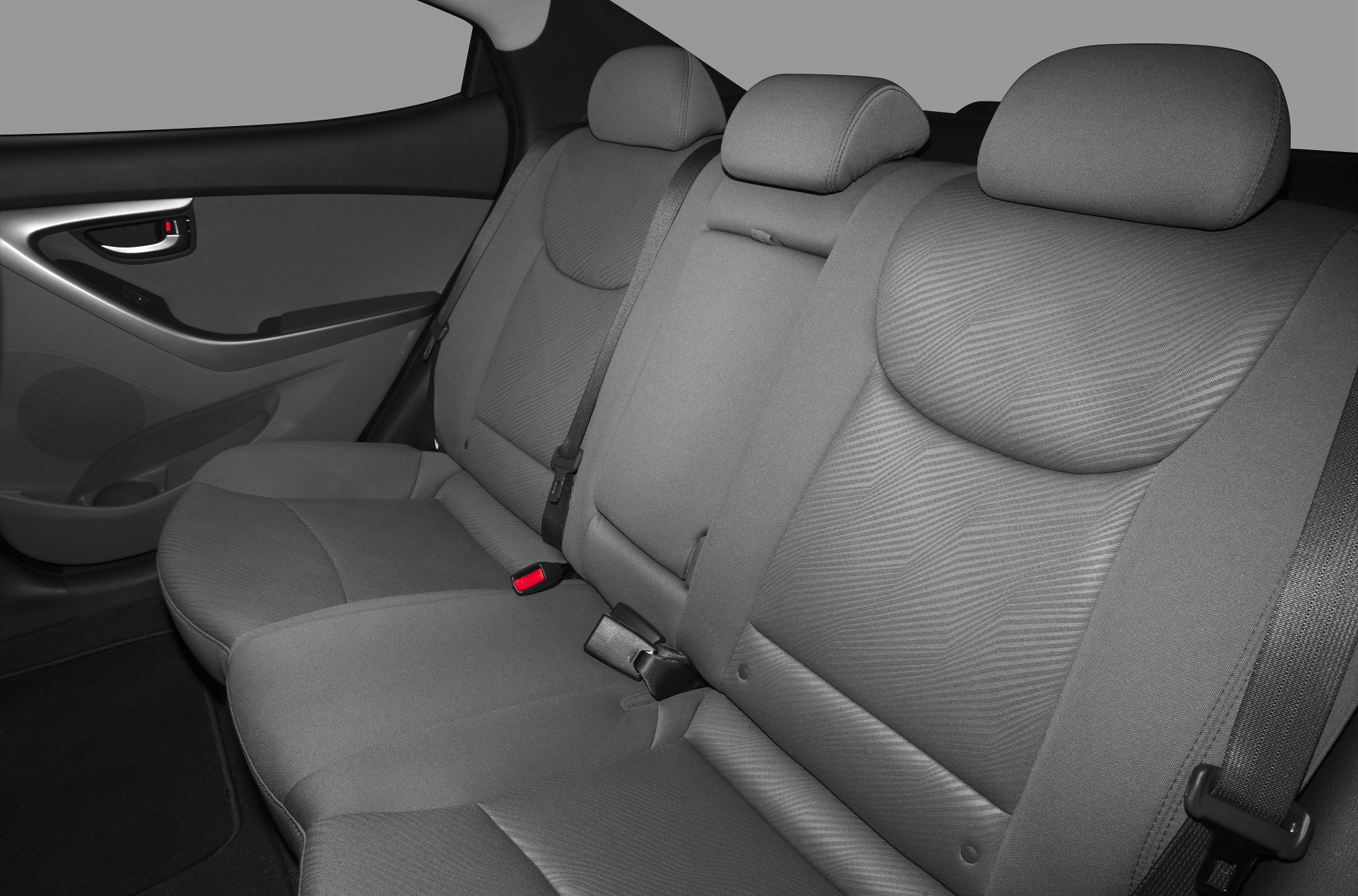 Rear seat interior with contoured seats and adjustable headrests