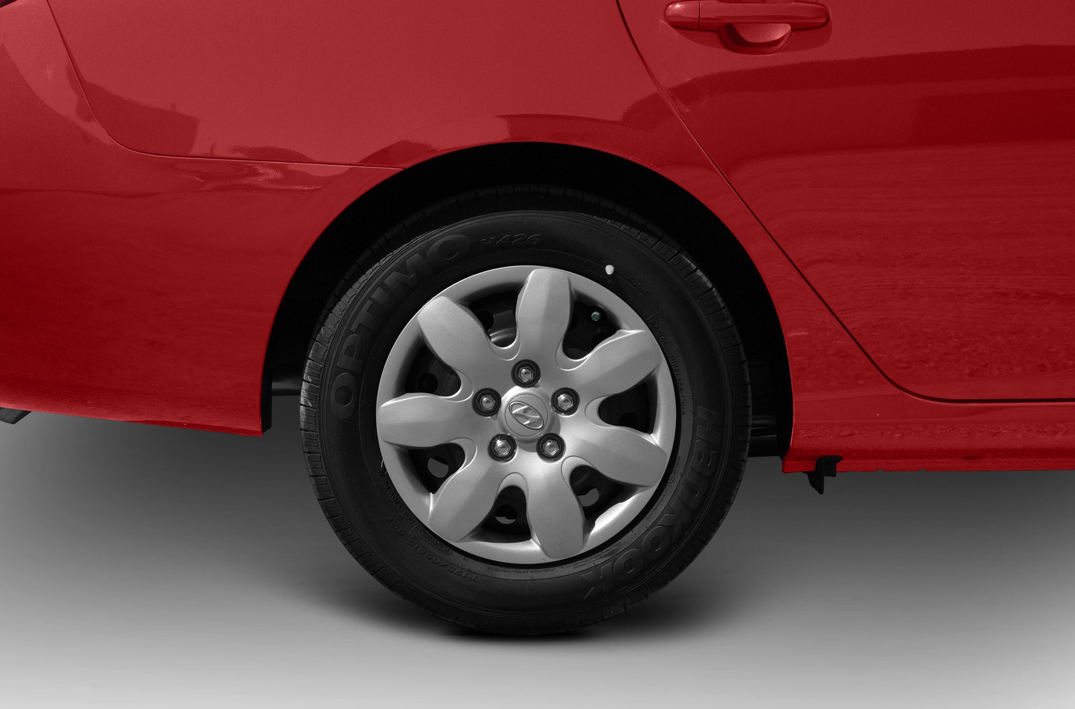 Alloy wheel and rear door close-up with rim design and tire branding