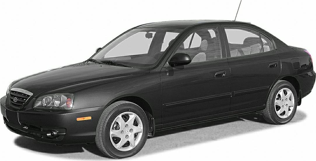 Black sedan with alloy wheels and distinctive front headlights