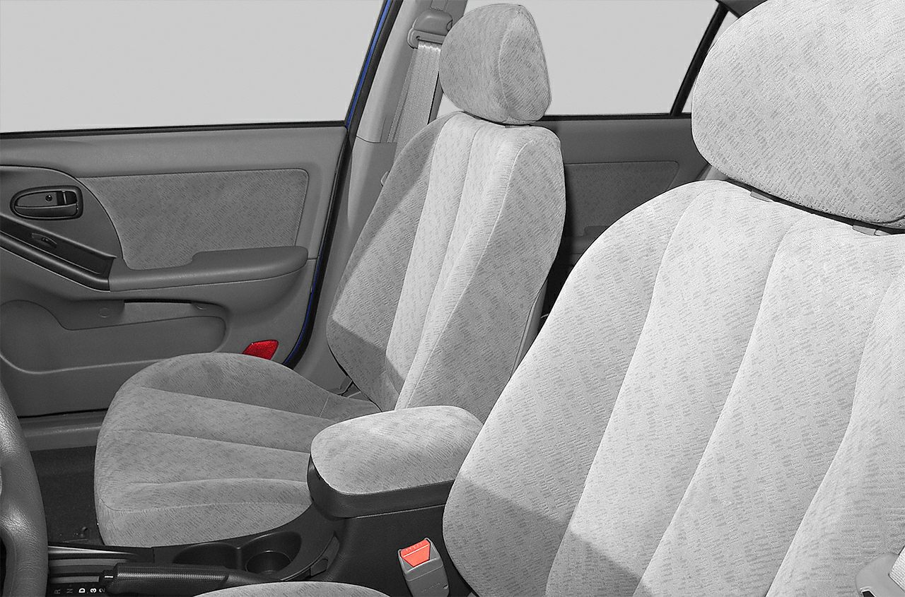 Front seats and door panel with fabric upholstery and armrest