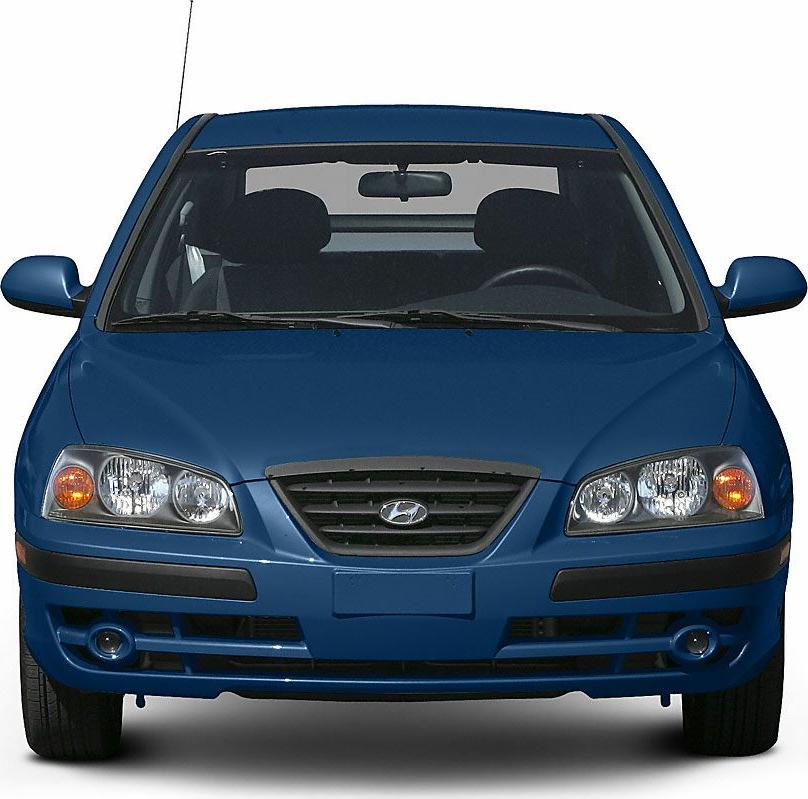 Front view showing headlights, grille, bumper, and fog lights of hatchback