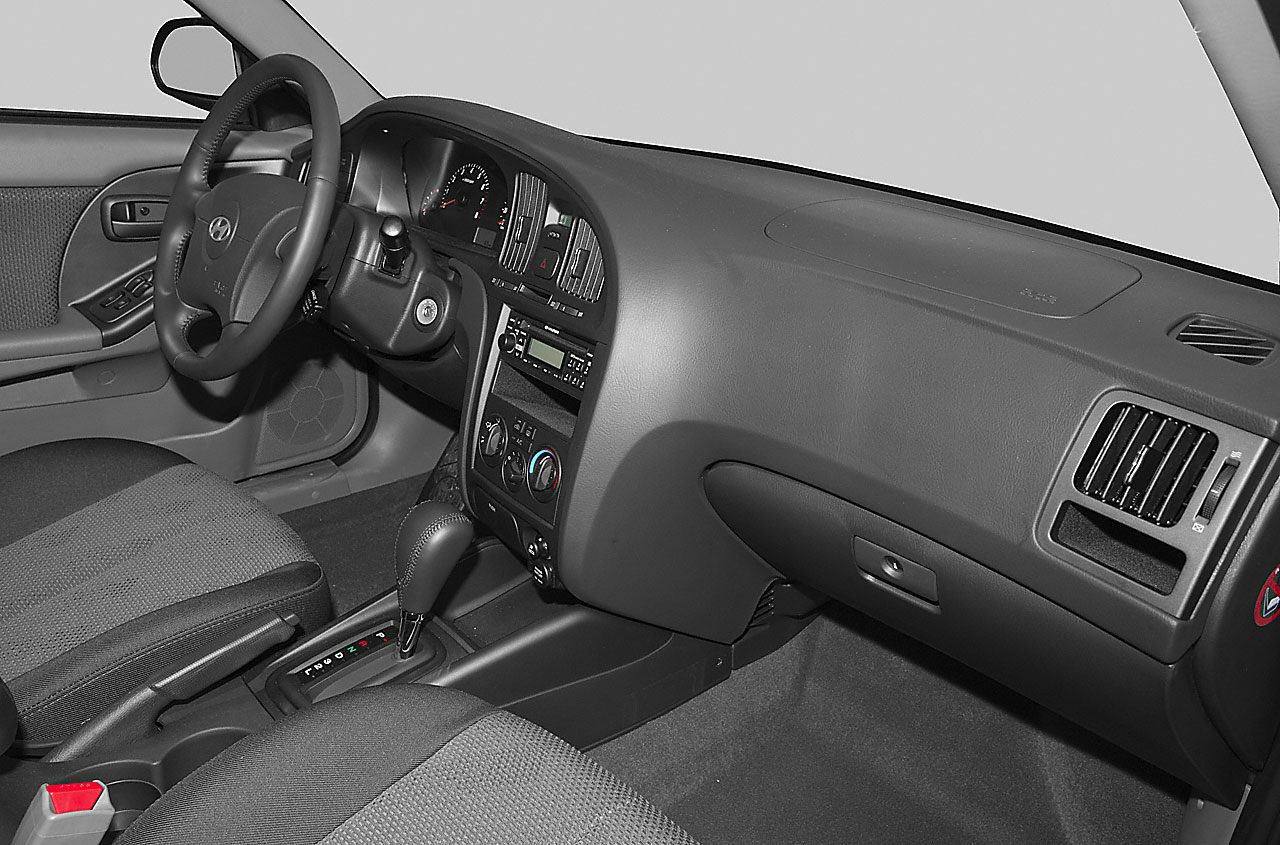 Dashboard and steering wheel with center console and fabric seats