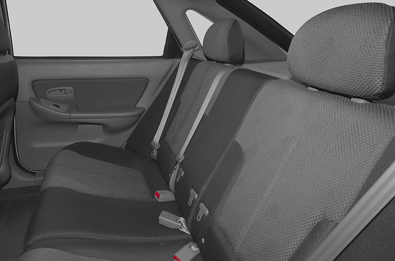 Rear seat interior with seat belts and headrests