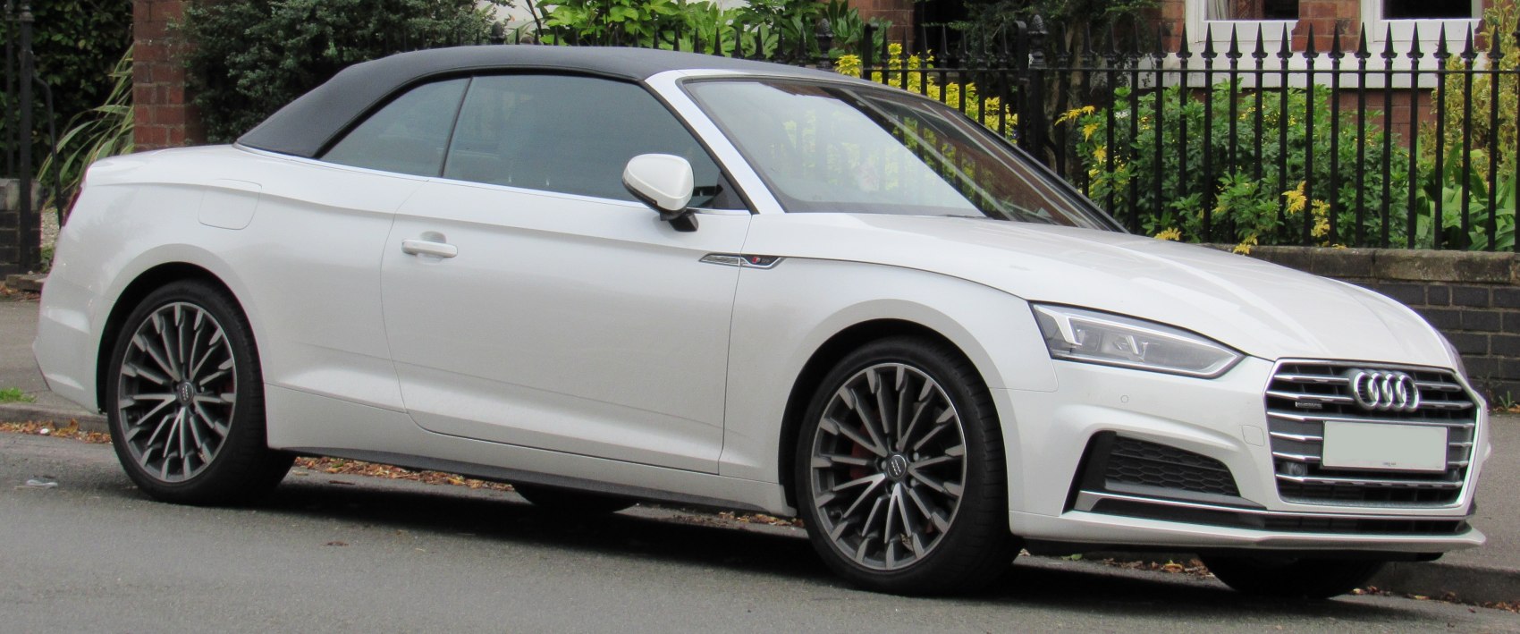 White soft top convertible with alloy wheels and LED headlights