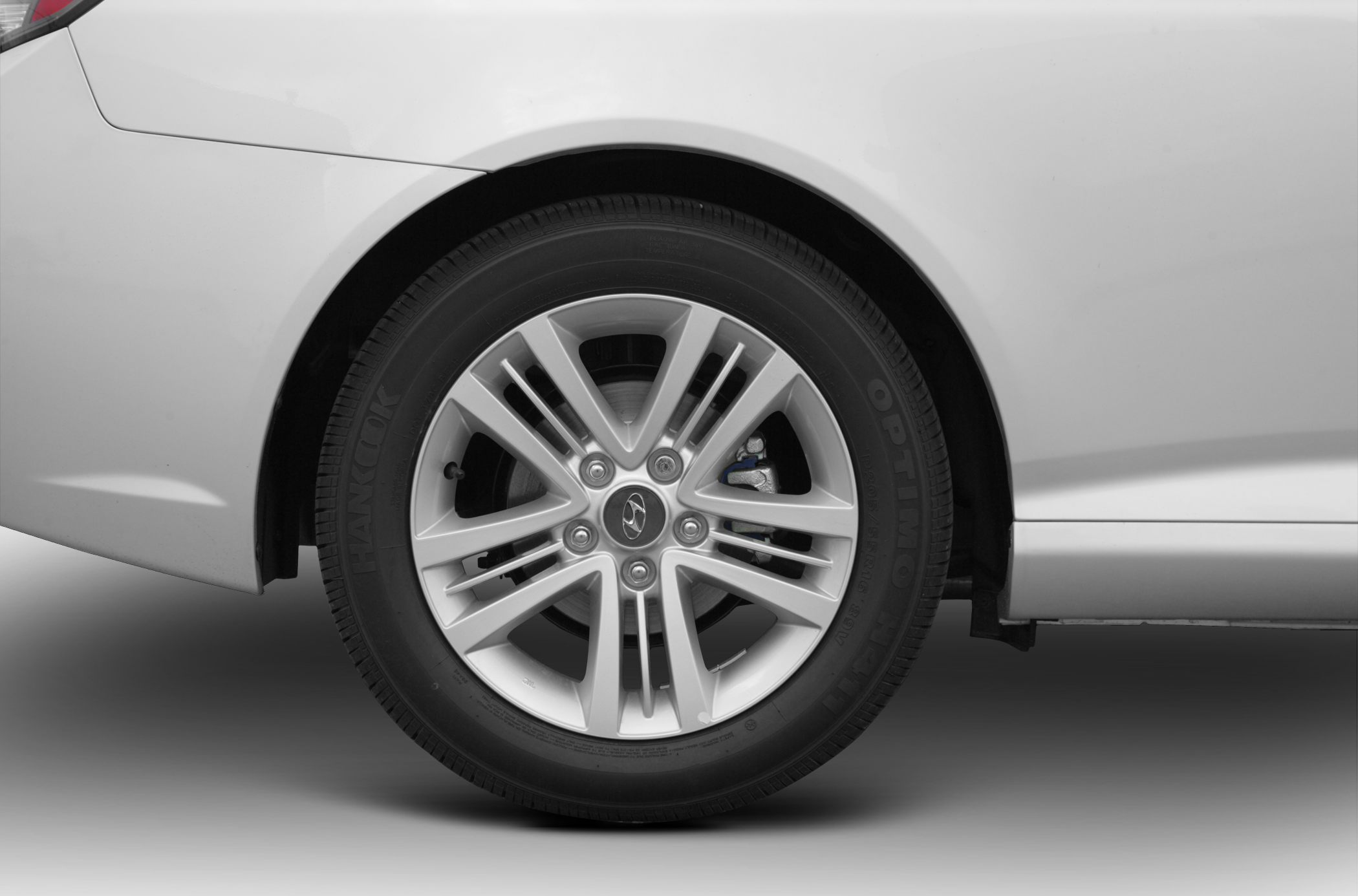 Detailed alloy wheel with Hankook Optimo tire on car rear side