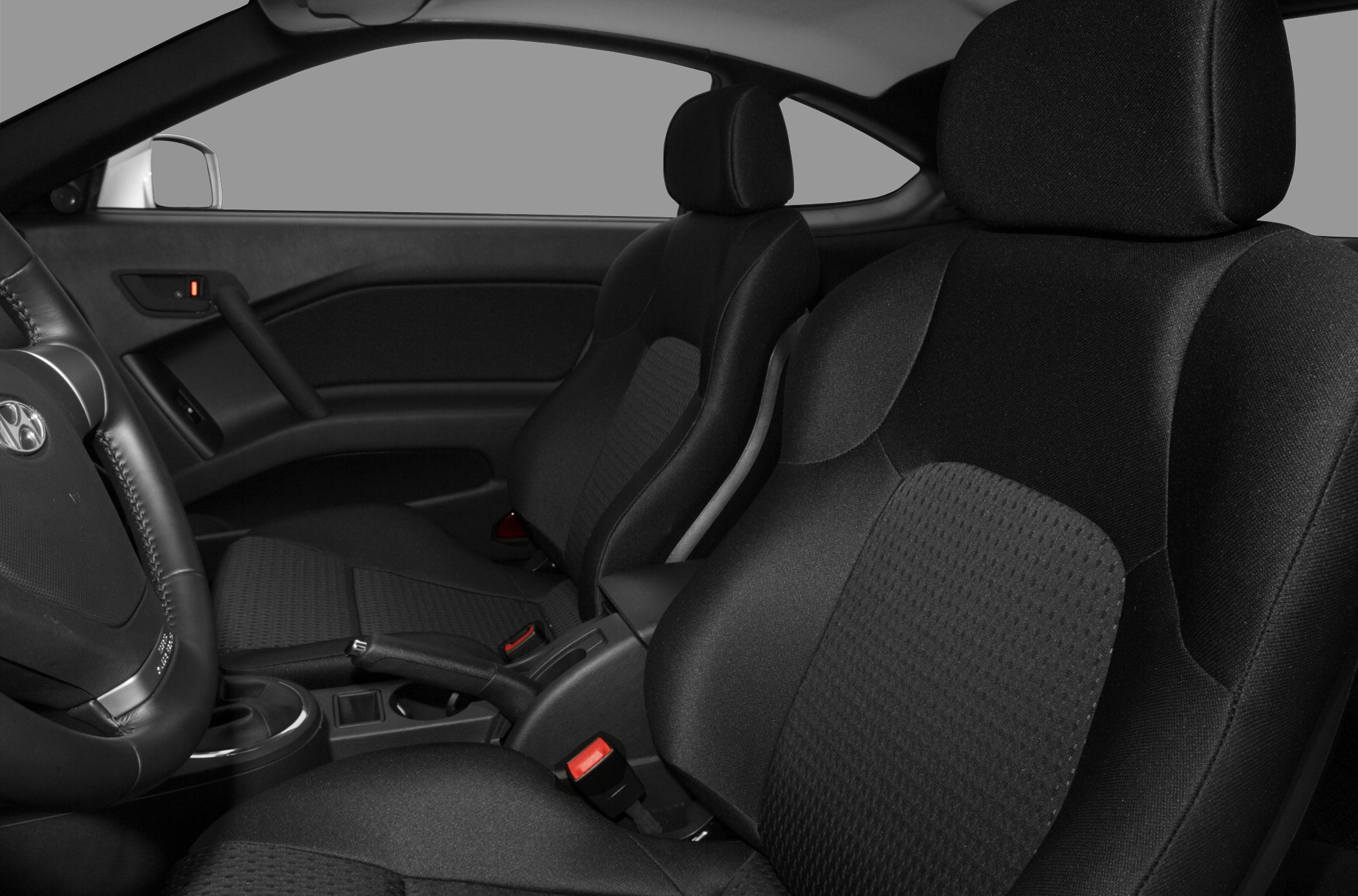 Front seats and interior cabin upholstery of a compact coupe