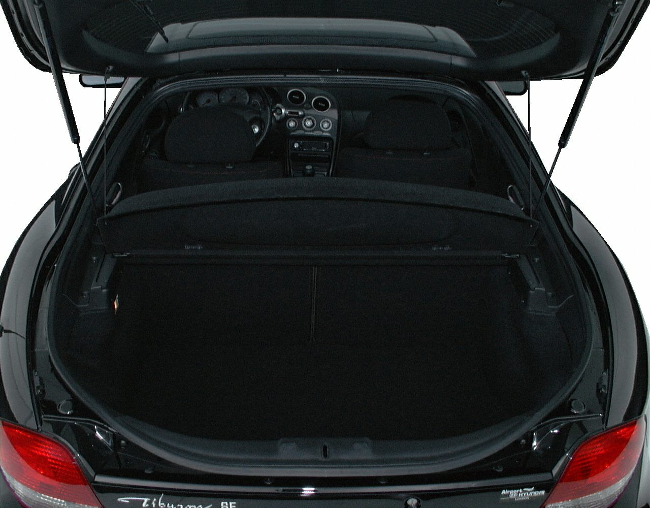 Rear cargo space and dashboard interior visible through open hatchback