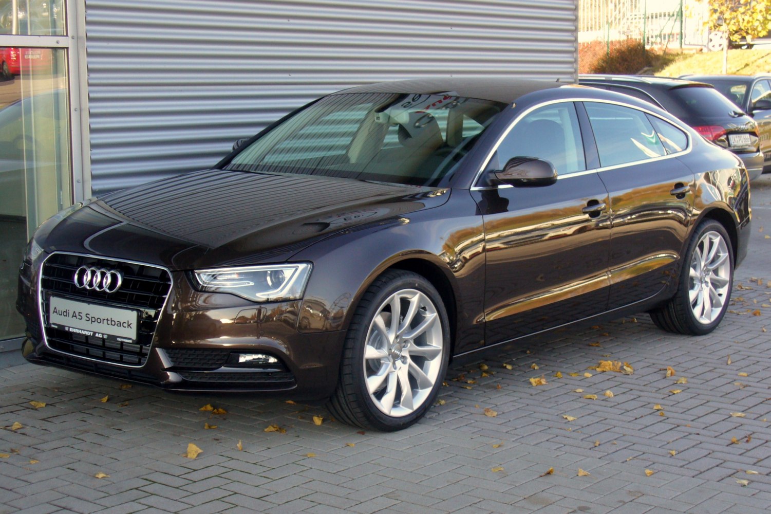 Front-side angle with signature grille and alloy wheels