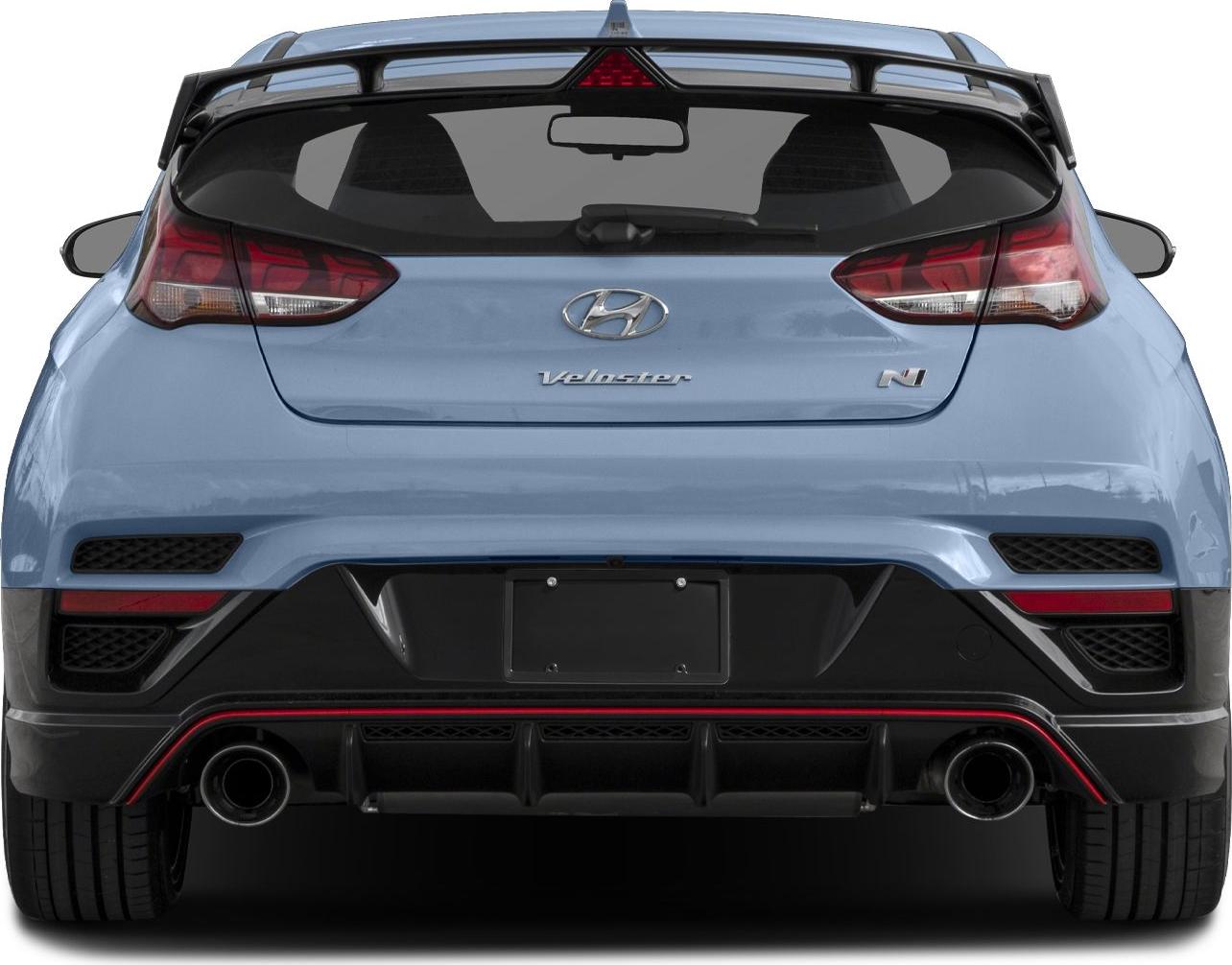 Dual exhaust pipes, rear diffuser, and spoiler on hatchback rear