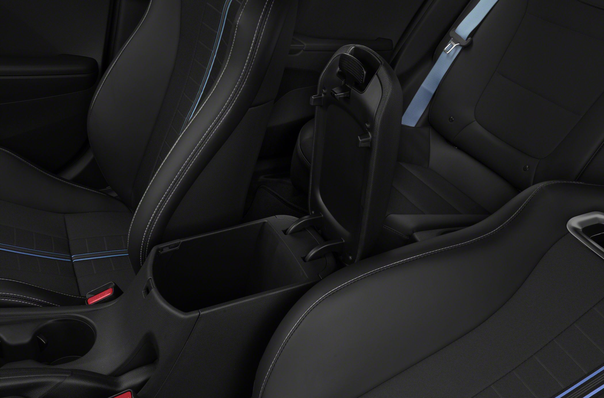 Open center console storage compartment and detailed black car seats