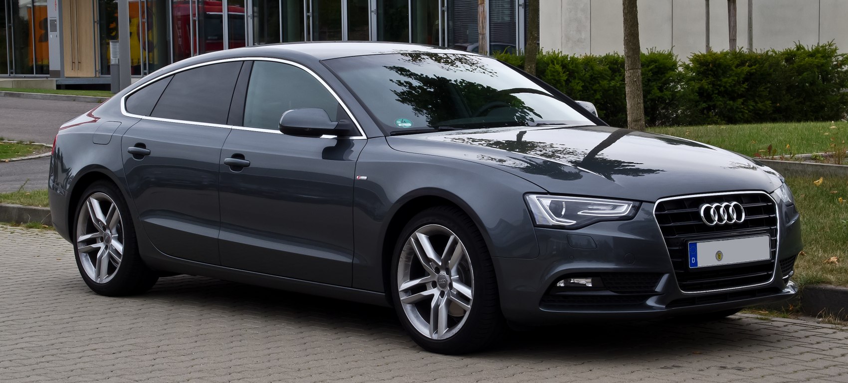 Front-side view with LED headlights and alloy wheels