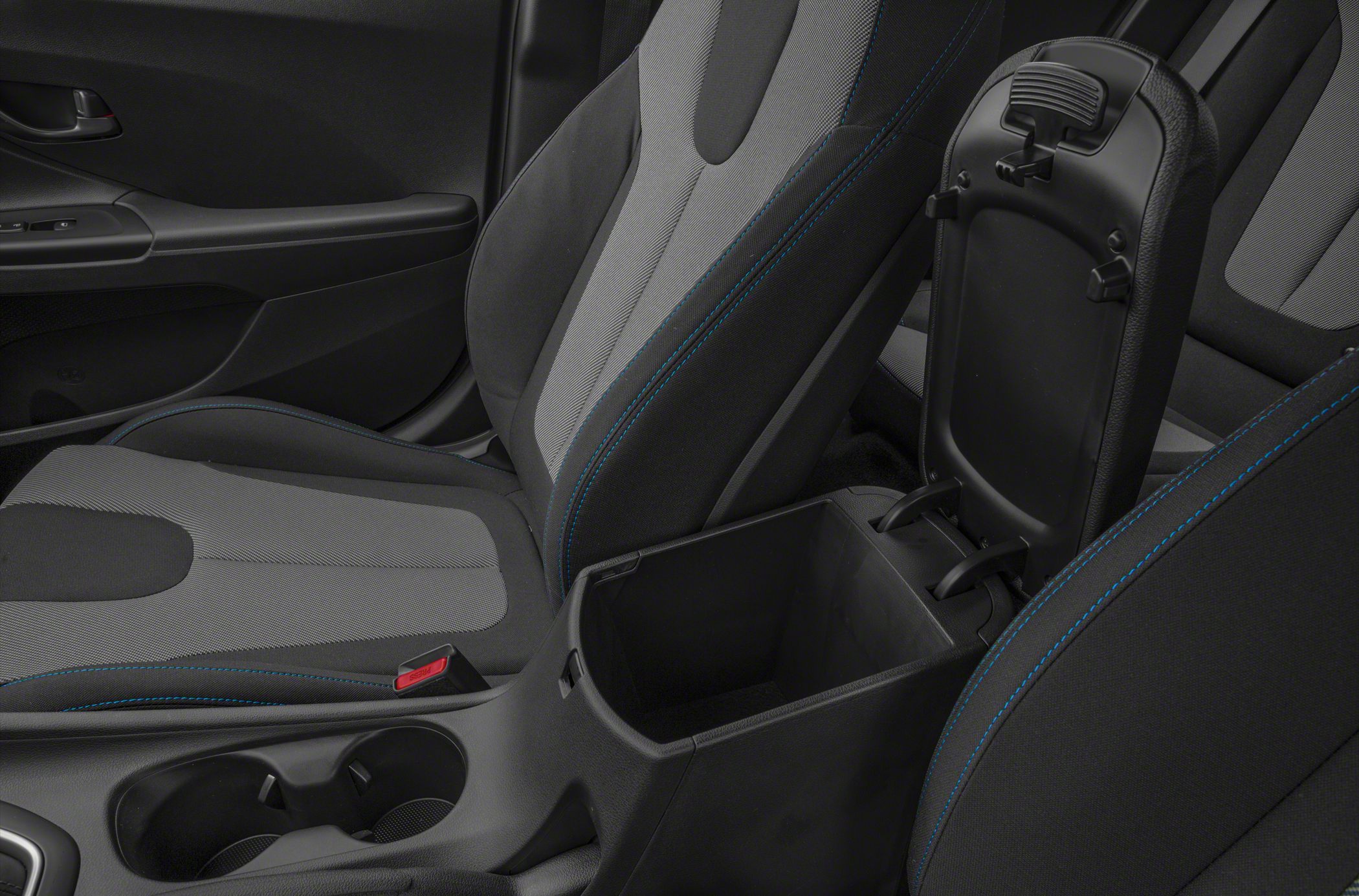 Center console storage compartment with dual cup holders and fabric-trimmed seats