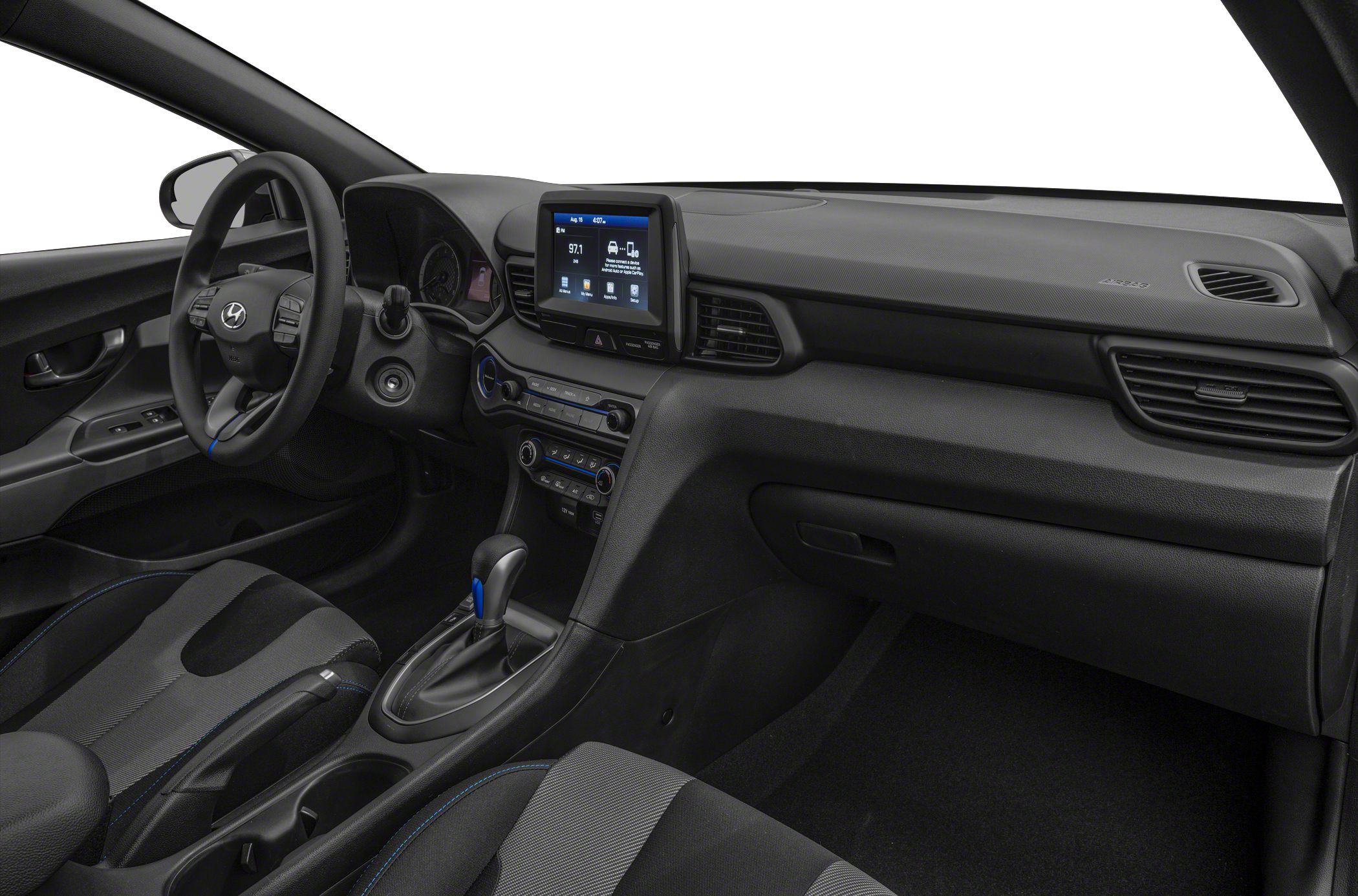 Dashboard with infotainment screen, steering wheel, and center console gear shifter