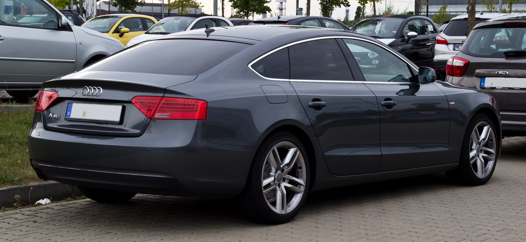 Rear side view with taillights and alloy wheels