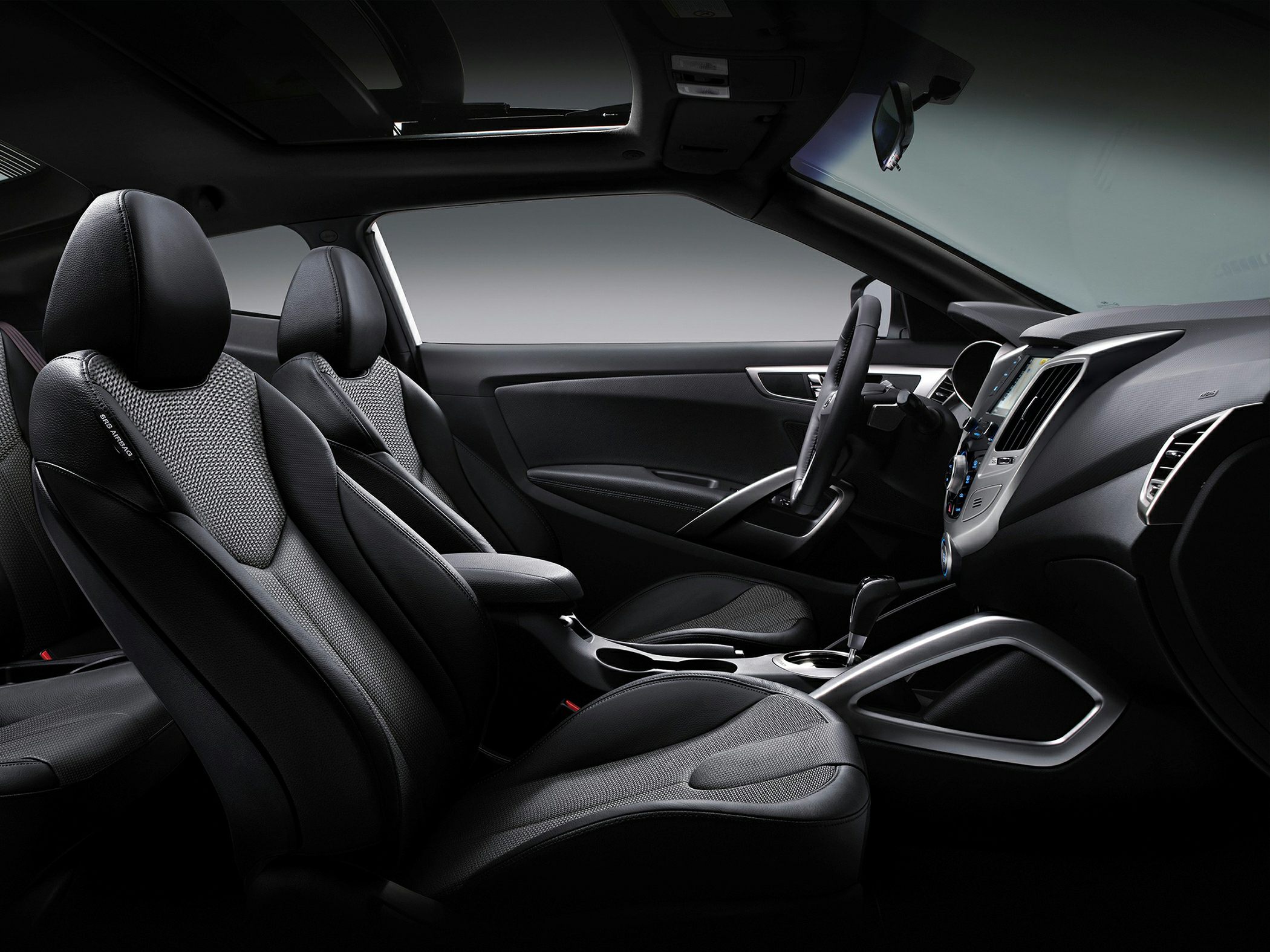 Sporty seats and modern dashboard with panoramic sunroof