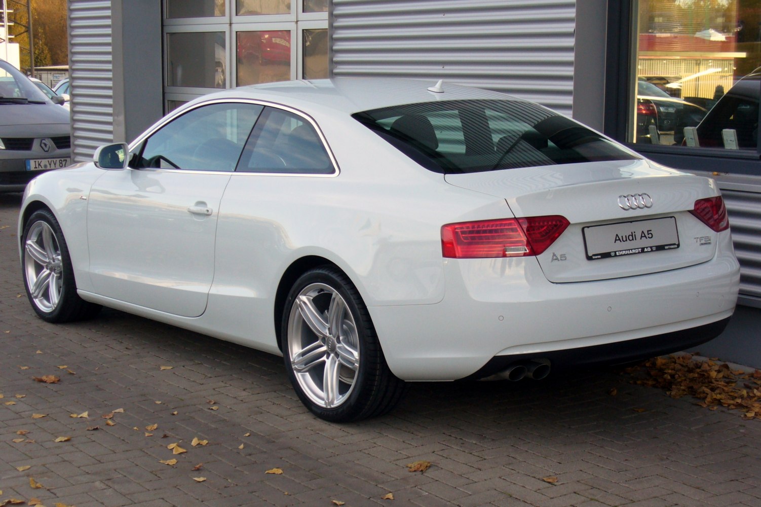 Rear view with alloy wheels and dual exhaust