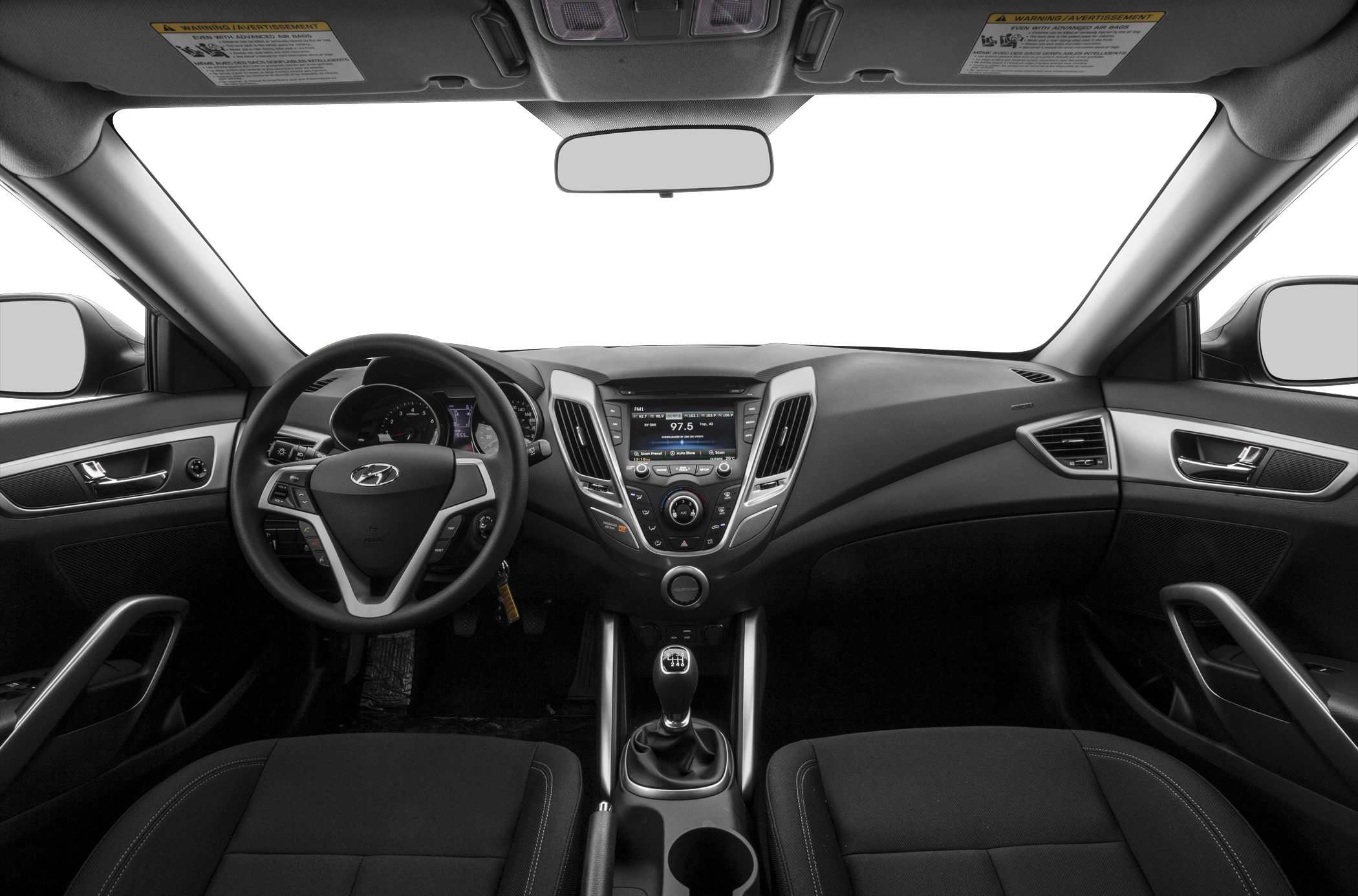 Dashboard, steering wheel with controls, and manual transmission shifter