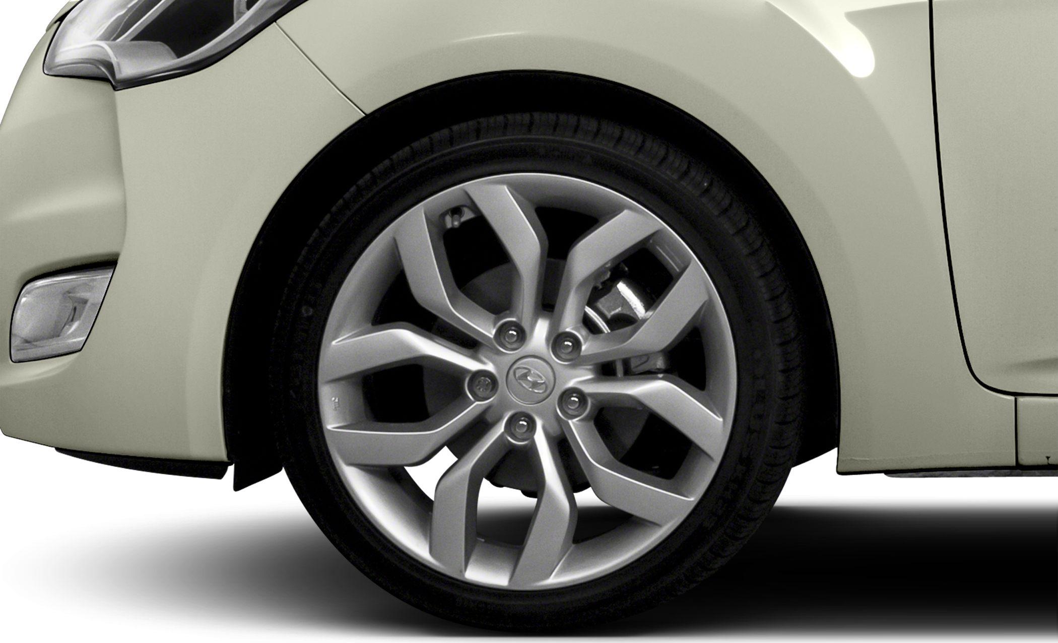 Close-up of 2012 Hyundai Veloster alloy wheel and front fender