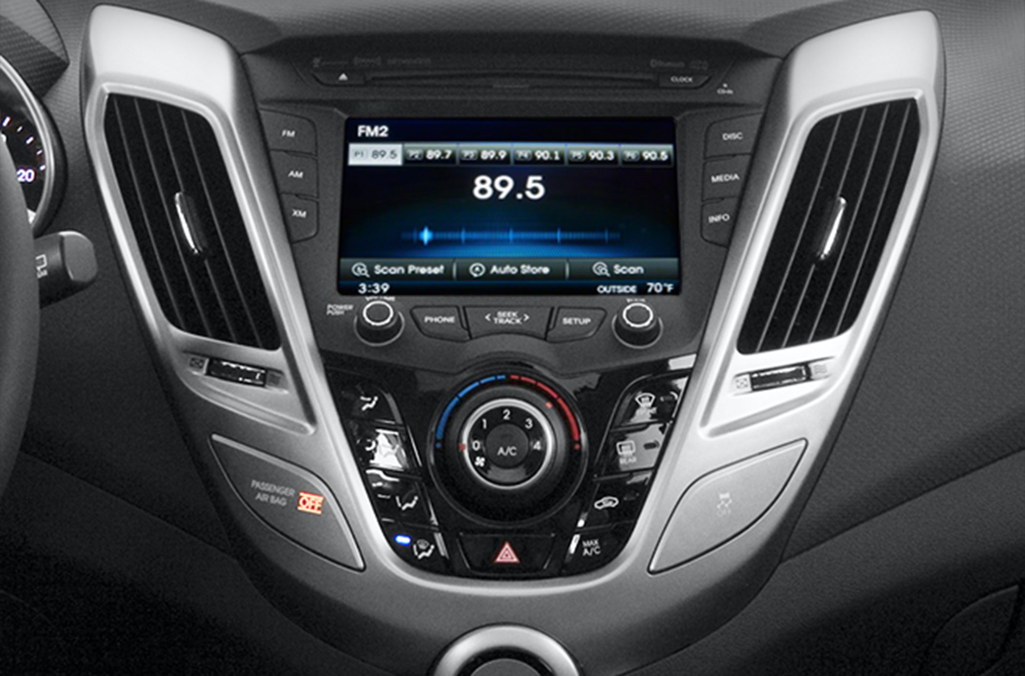 Touchscreen radio and circular climate control dial in car center console