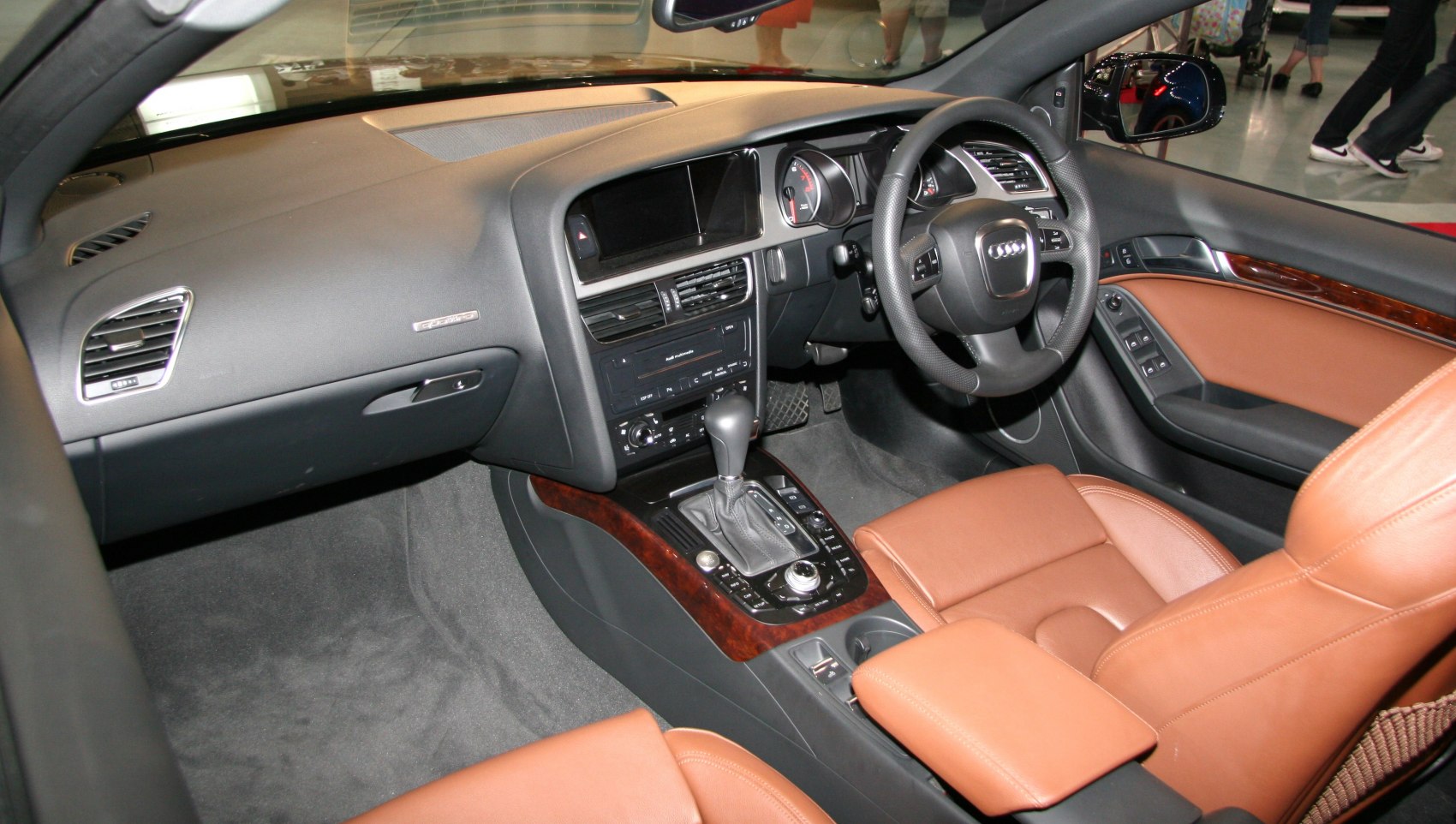 Luxury brown leather seats and wood trim interior